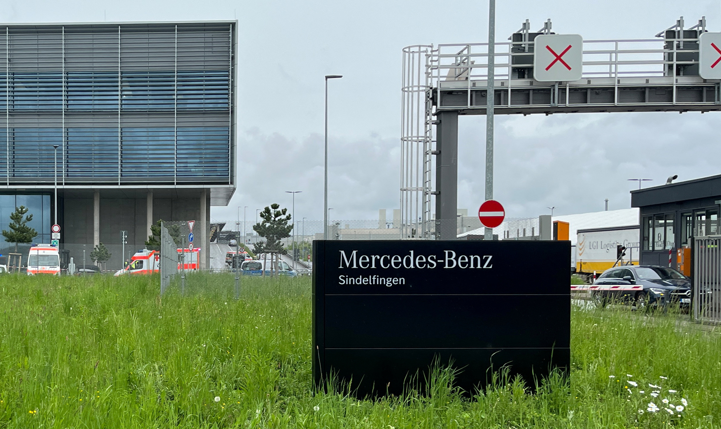 Ambulance cars are parked outside a Mercedes plant after a suspect was detained following a shooting at a Mercedes-Benz plant in Sindelfingen near Stuttgart, Germany, May 11, 2023.     REUTERS