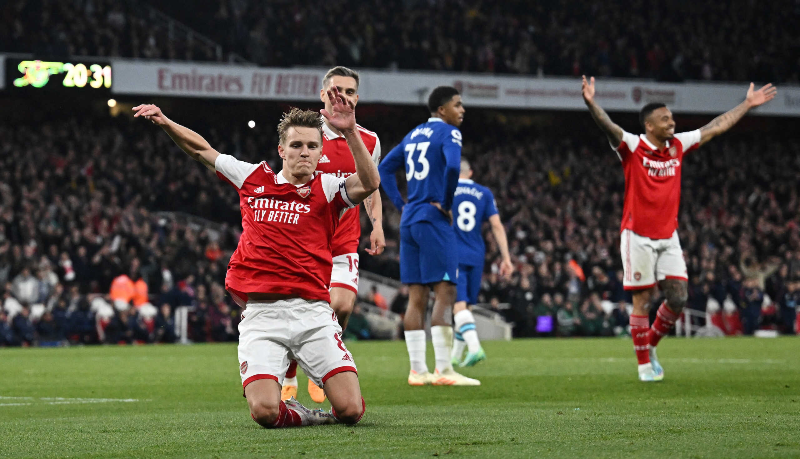 Soccer Football - Premier League - Arsenal v Chelsea - Emirates Stadium, London, Britain - May 2, 2023  Arsenal's Martin Odegaard celebrates scoring their second goal with Leandro Trossard REUTERS