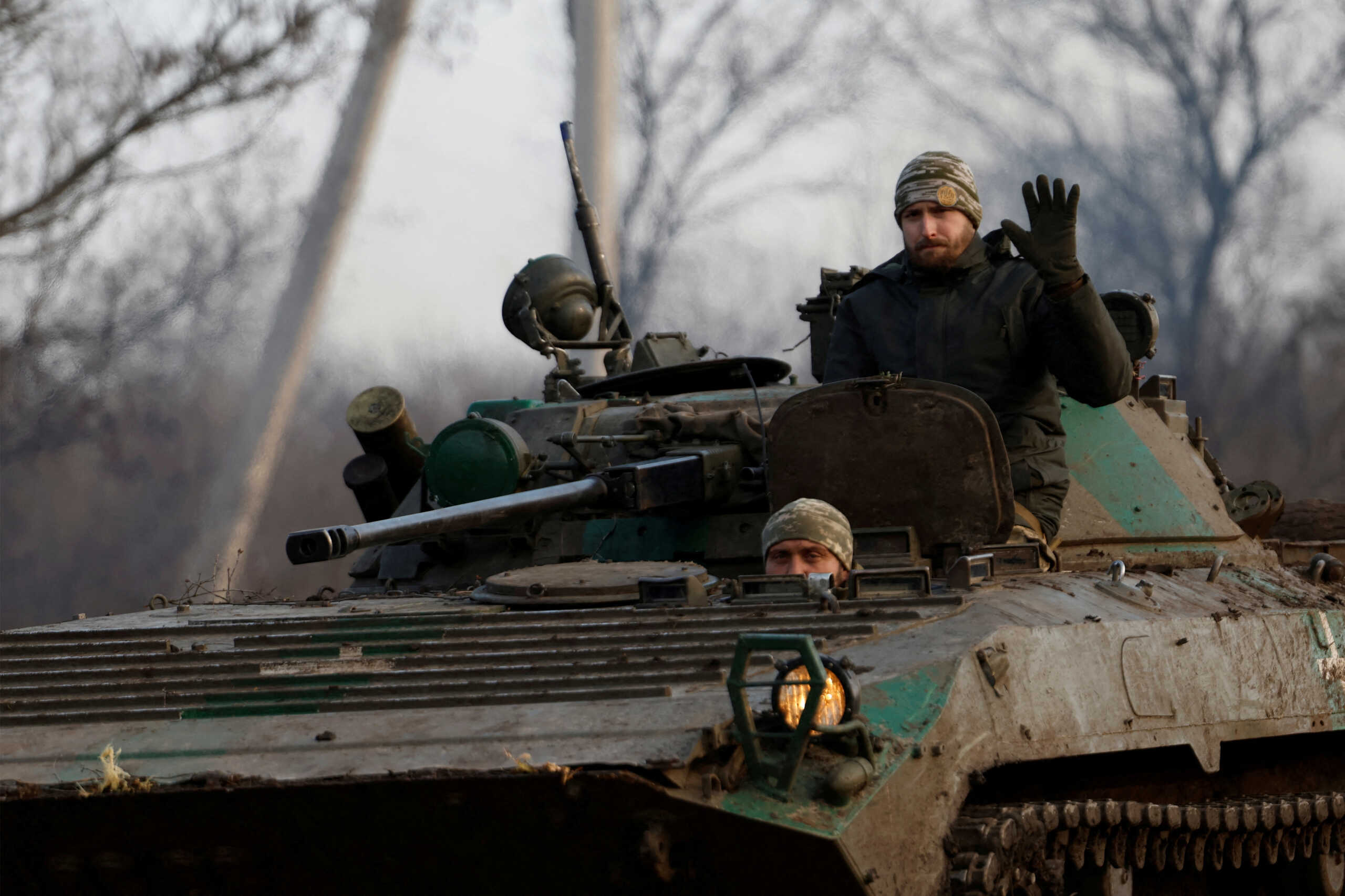 FILE PHOTO: A Ukrainian serviceman waves from a tank, as Russia's attack on Ukraine continues, during intense shelling on Christmas Day at the frontline in Bakhmut, Ukraine, December 25, 2022. REUTERS