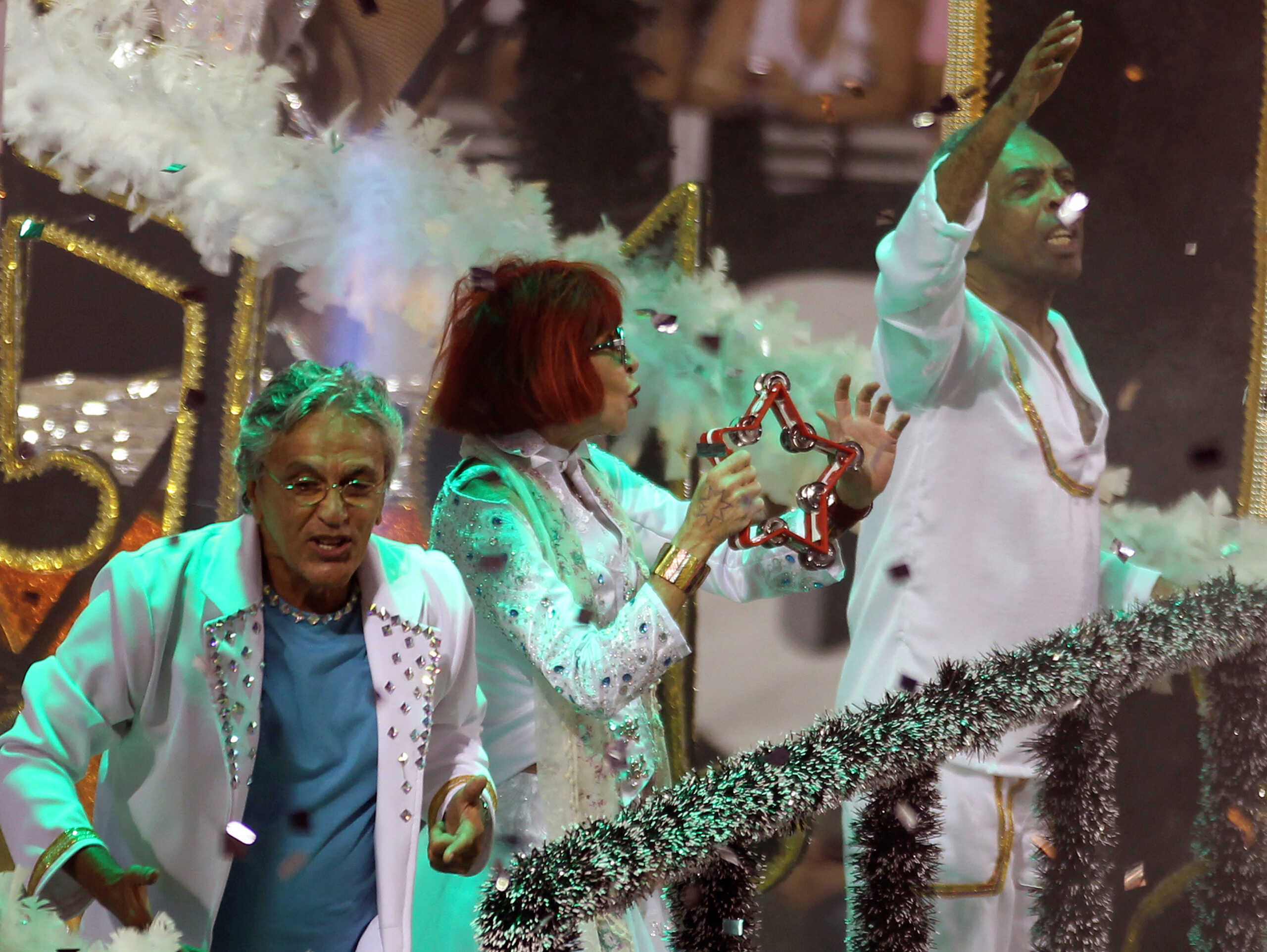 FILE PHOTO: Brazilian singers Caetano Veloso (L), Rita Lee and Gilberto Gil (R) stand on the Aguia de Ouro Samba School float during a carnival at Anhembi Sambadrome in Sao Paulo February 19, 2012. REUTERS