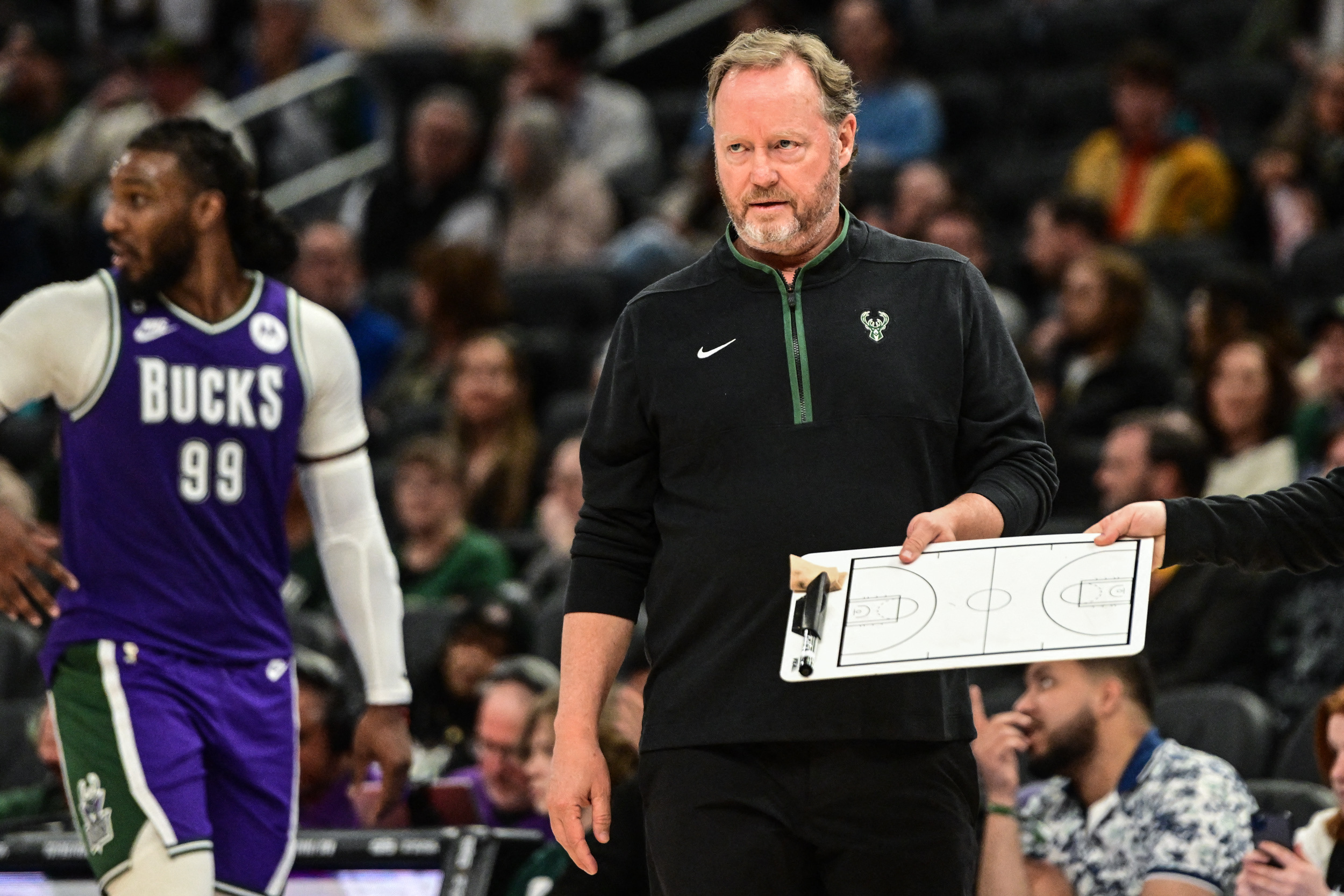 Apr 7, 2023; Milwaukee, Wisconsin, USA; Milwaukee Bucks head coach Mike Budenholzer calls a play in the fourth quarter during game against the Memphis Grizzlies at Fiserv Forum. Mandatory Credit: Benny Sieu-USA TODAY Sports