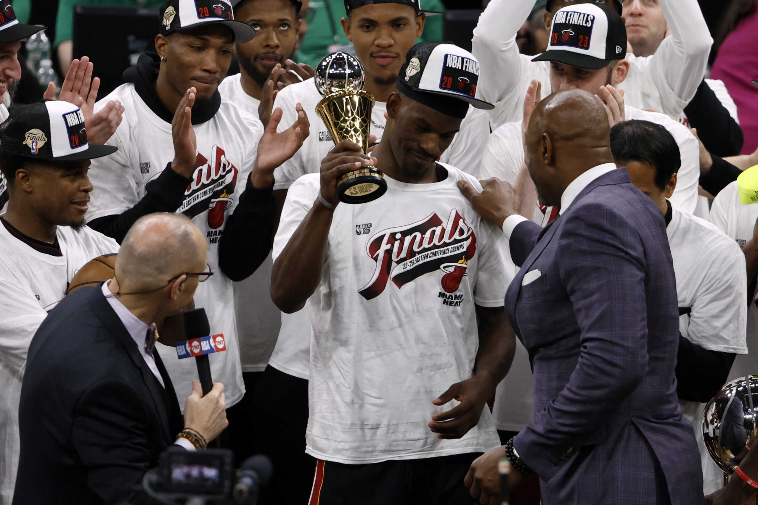 May 29, 2023; Boston, Massachusetts, USA; Miami Heat forward Jimmy Butler (22) celebrates with the MVP trophy after the Heat defeated the Boston Celtics in game seven of the Eastern Conference Finals for the 2023 NBA playoffs at TD Garden. Mandatory Credit: Winslow Townson-USA TODAY Sports