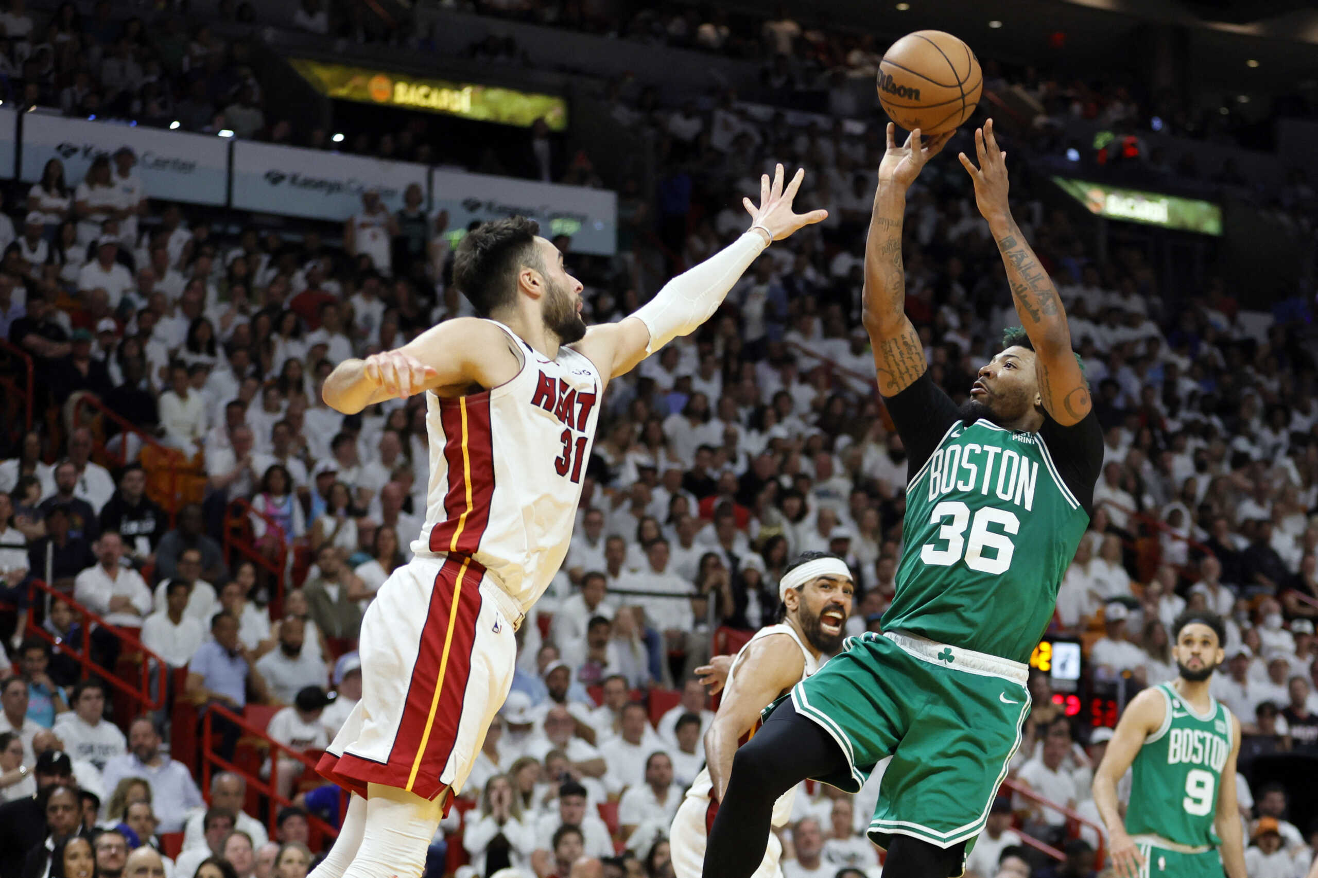 May 27, 2023; Miami, Florida, USA; Boston Celtics guard Marcus Smart (36) shoots against Miami Heat guard Max Strus (31) in the third quarter during game six of the Eastern Conference Finals for the 2023 NBA playoffs at Kaseya Center. Mandatory Credit: Sam Navarro-USA TODAY Sports