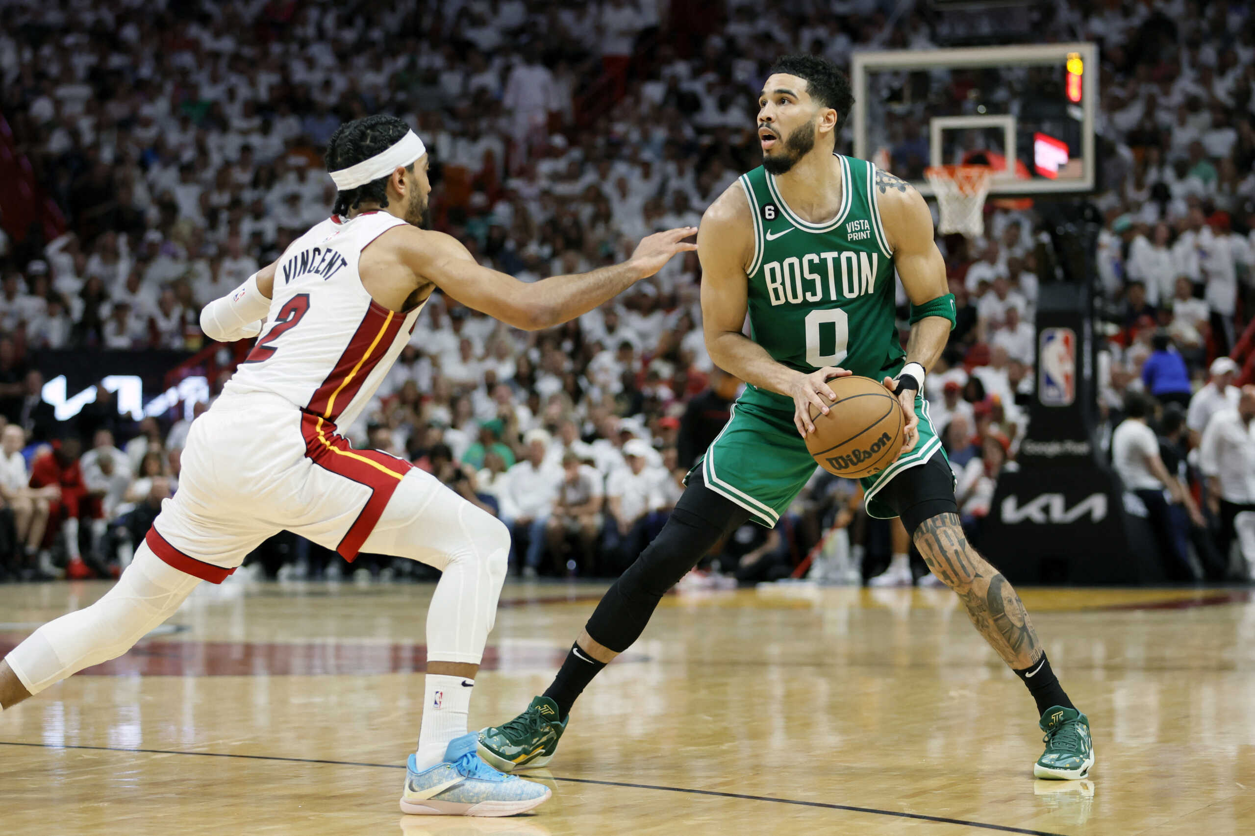 May 23, 2023; Miami, Florida, USA; Boston Celtics forward Jayson Tatum (0) controls the ball against Miami Heat guard Gabe Vincent (2) in the third quarter during game four of the Eastern Conference Finals for the 2023 NBA playoffs at Kaseya Center. Mandatory Credit: Sam Navarro-USA TODAY Sports