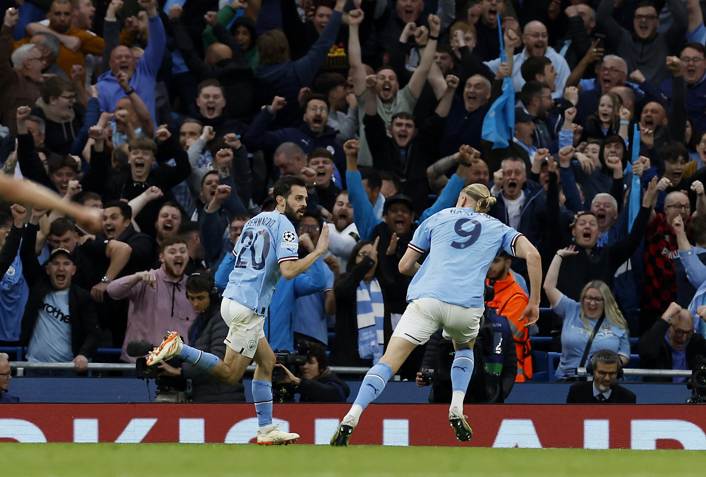 Soccer Football - Champions League - Semi Final - Second Leg - Manchester City v Real Madrid - Etihad Stadium, Manchester, Britain - May 17, 2023  Manchester City's Bernardo Silva celebrates scoring their second goal with Erling Braut Haaland Action Images via Reuters