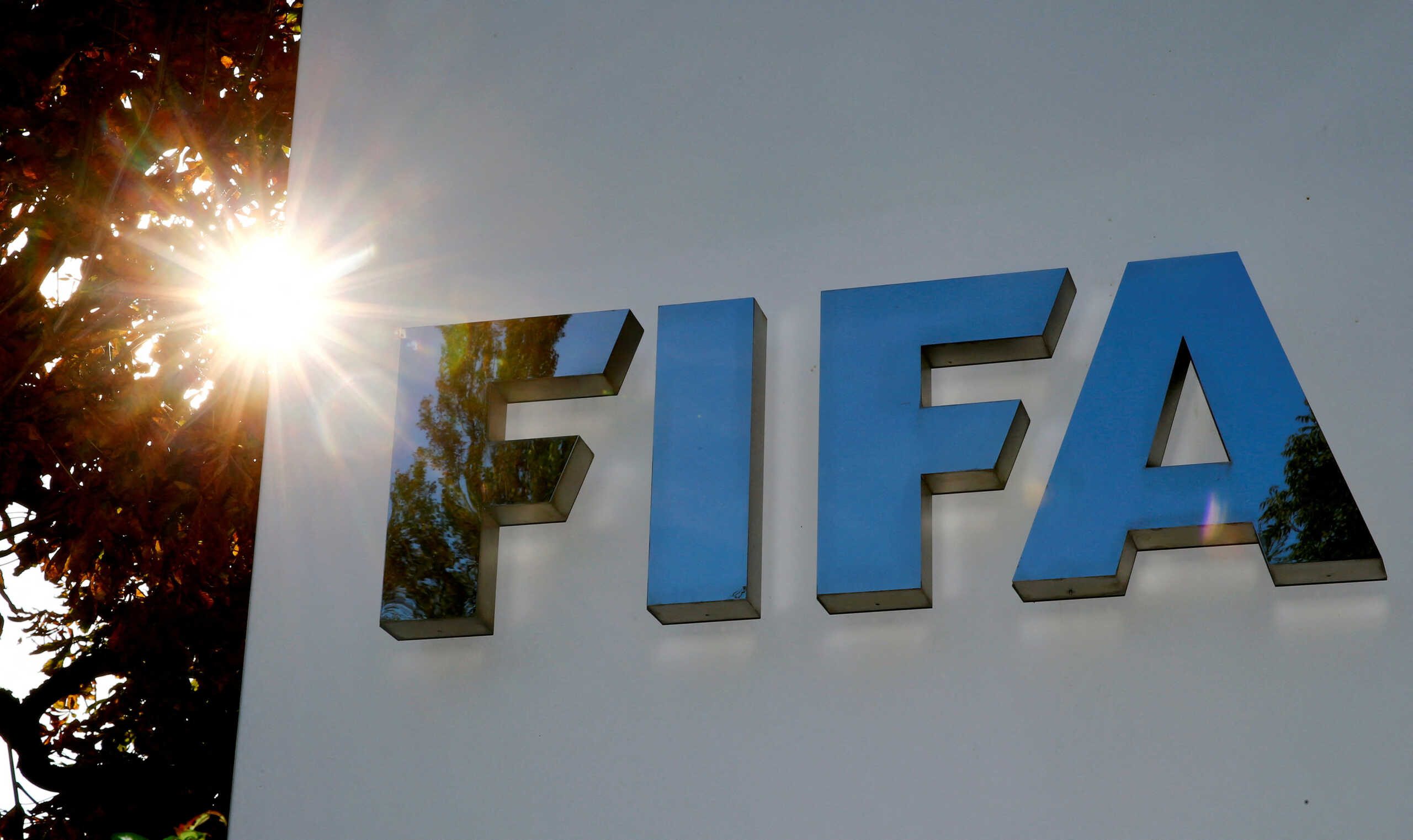 FILE PHOTO: The logo of FIFA is seen in front of its headquarters in Zurich, Switzerland September 26, 2017.   REUTERS