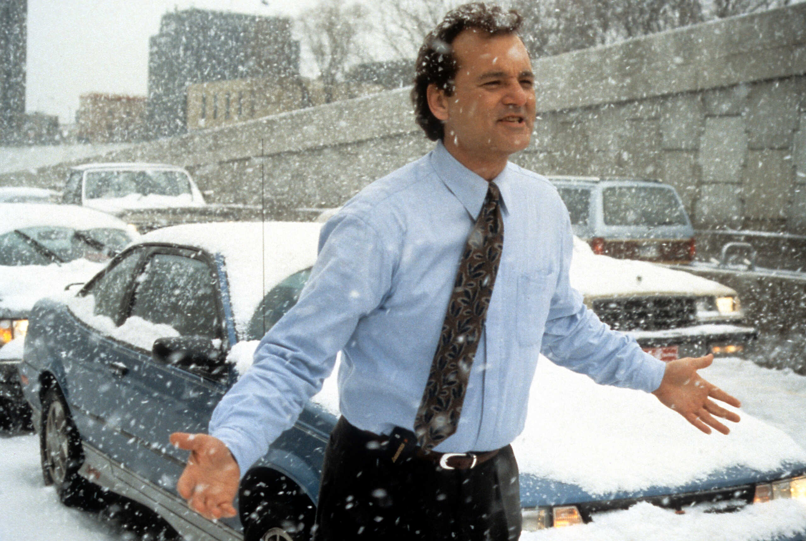Bill Murray runs through the snow in a scene from the film 'Groundhog Day', 1993. (Photo by Columbia Pictures