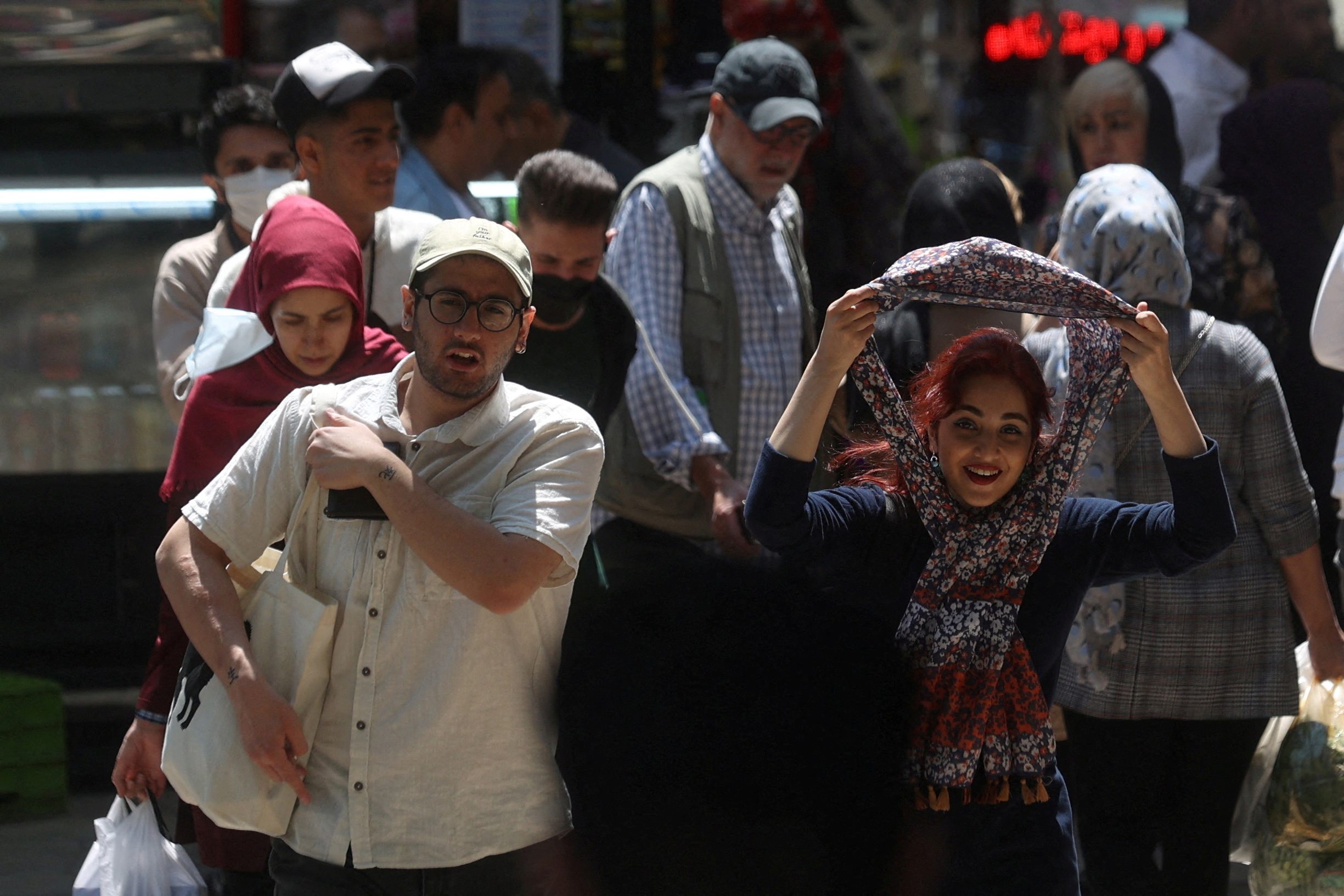 FILE PHOTO: An Iranian woman walks on a street amid the implementation of the new hijab surveillance in Tehran, Iran, April 15, 2023. Majid Asgaripour