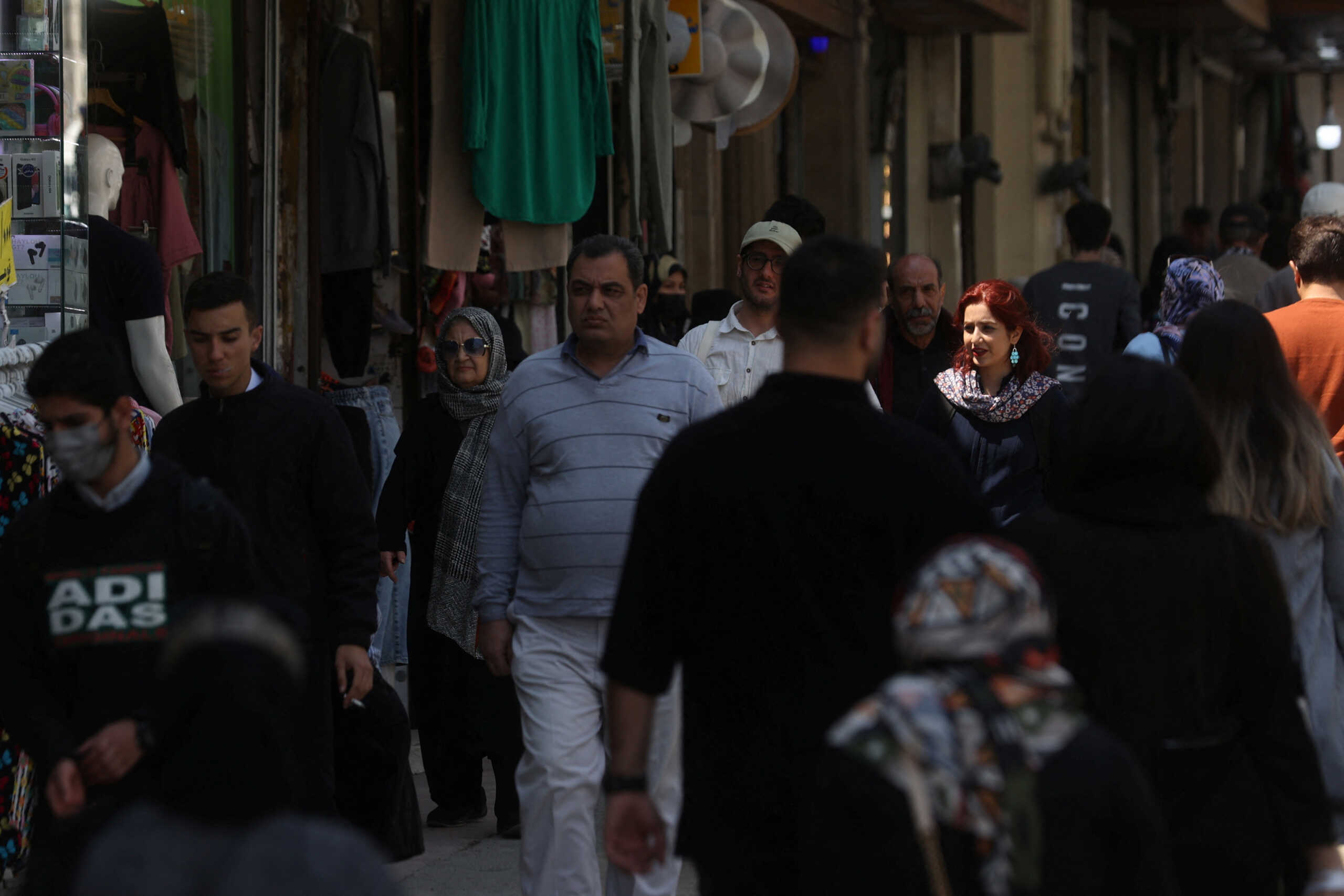 An Iranian woman walks on a street amid the implementation of the new hijab surveillance in Tehran, Iran, April 15, 2023. Majid Asgaripour
