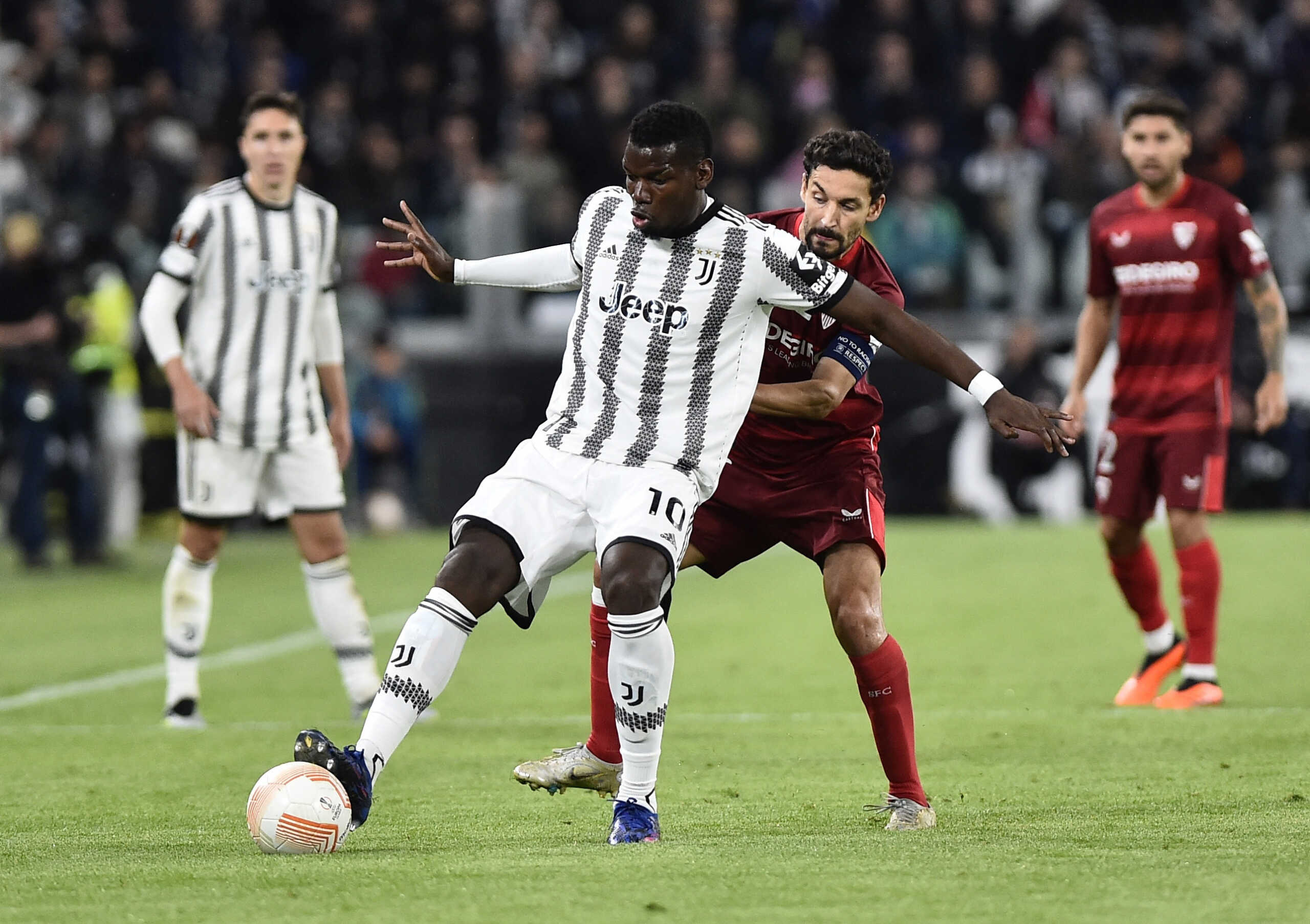 Soccer Football - Europa League - Semi Final - First Leg - Juventus v Sevilla - Allianz Stadium, Turin, Italy - May 11, 2023 Juventus' Paul Pogba in action with Sevilla's Jesus Navas REUTERS