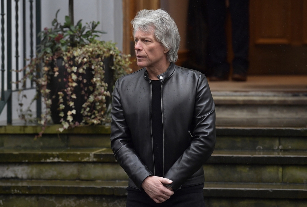 epa08255513 US singer Jon Bon Jovi waits for Britain's Harry, Duke of Sussex (unseen) at Abbey Road Studios in London, Britain, 28 February 2020. The British royal watched the Invictus Choir record the charity song 'Unbroken.' The Duke of Sussex with formally step back from royal duties on 31 March 2020  EPA
