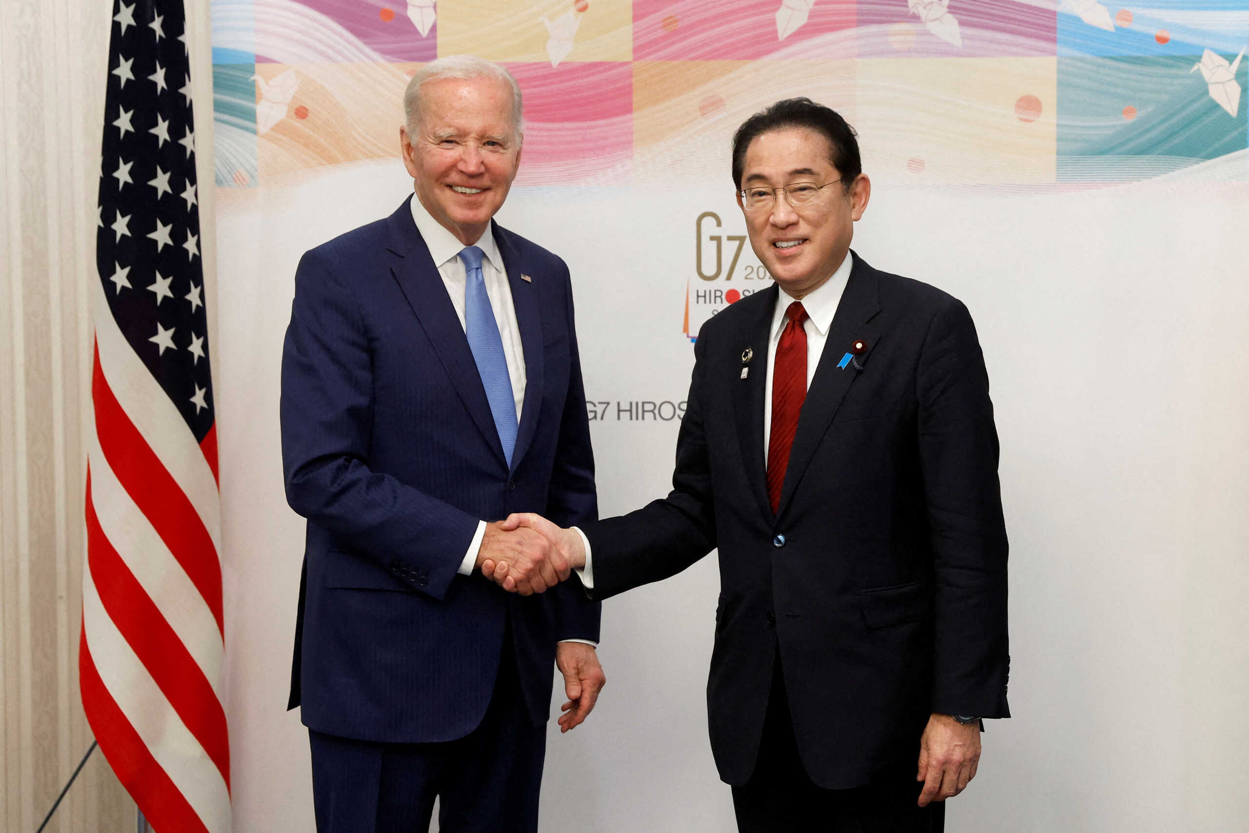 U.S. President Joe Biden and Fumio Kishida, Japan's prime minister, shake hands prior to a bilateral meeting ahead of the Group of Seven (G-7) leaders summit in Hiroshima, Japan, on Thursday, May 18, 2023. Kiyoshi Ota