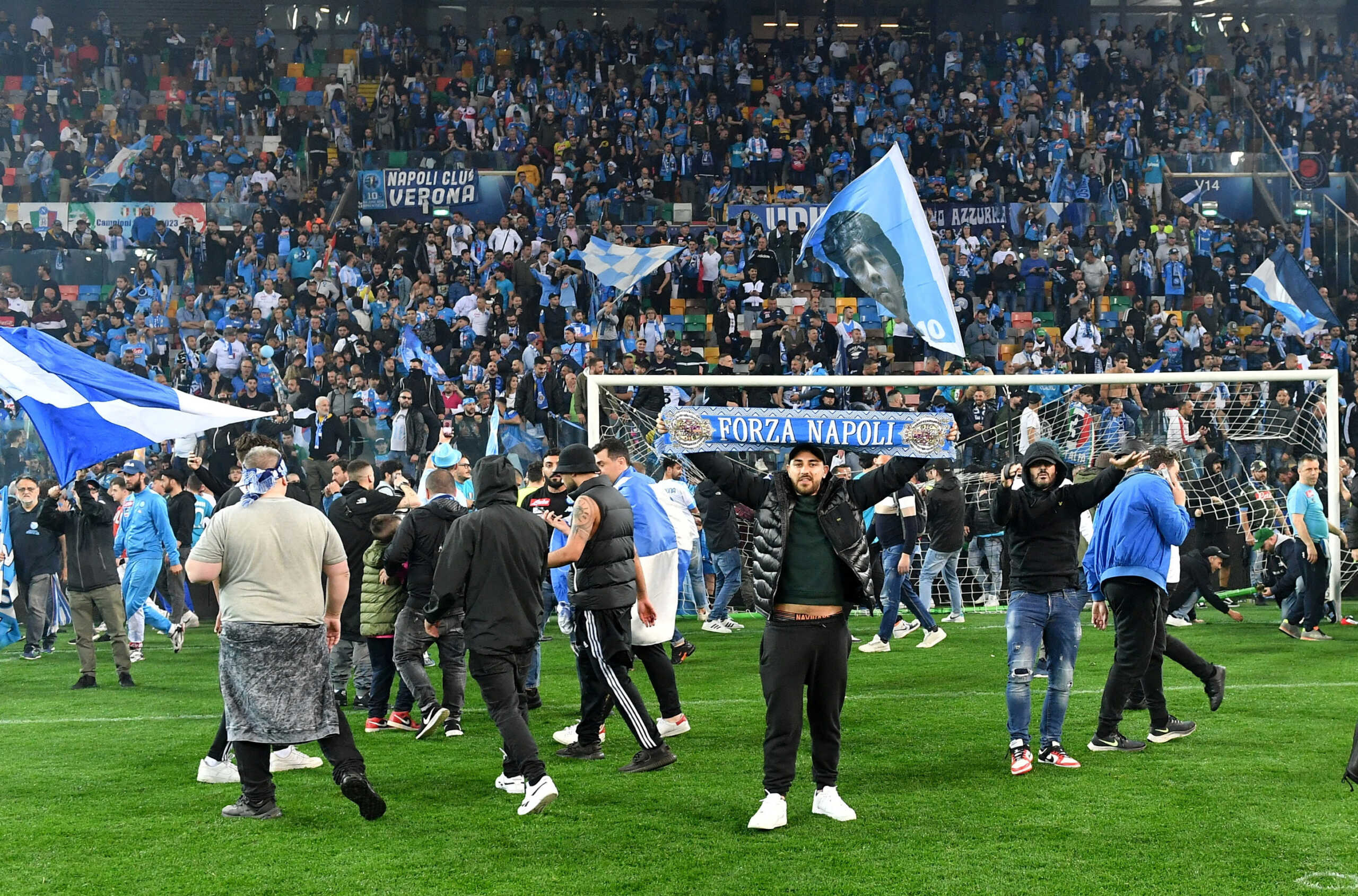 Soccer Football - Serie A - Udinese v Napoli - Dacia Arena, Udine, Italy - May 4, 2023 Napoli fans celebrate winning Serie A on the pitch after the match REUTERS