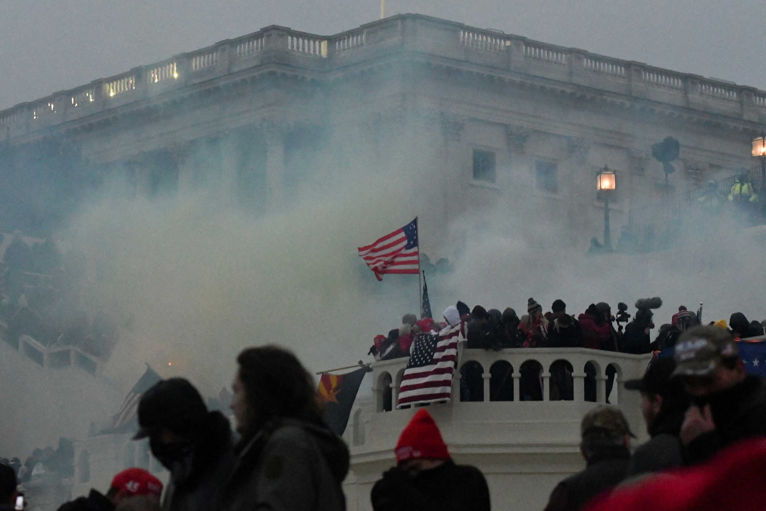 FILE PHOTO: Police clear the U.S. Capitol Building with tear gas as supporters of U.S. President Donald Trump gather outside, in Washington, U.S. January 6, 2021. REUTERS