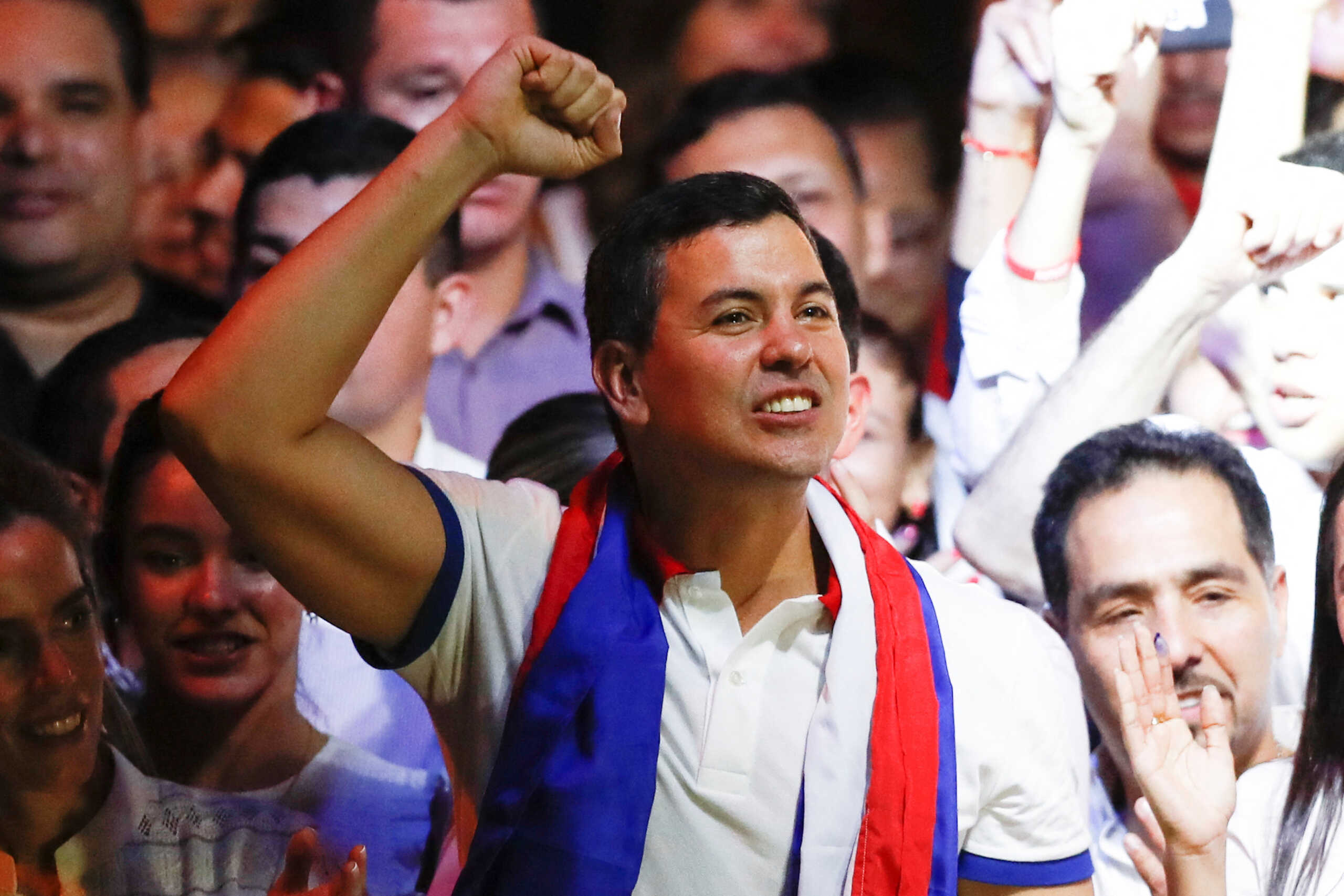Paraguayan presidential candidate Santiago Pena from the ruling Colorado Party celebrates at the party headquarters as he and his running mate Pedro Alliana won Paraguay's presidential race, according to the preliminary official count, in Asuncion, Paraguay April 30, 2023. REUTERS