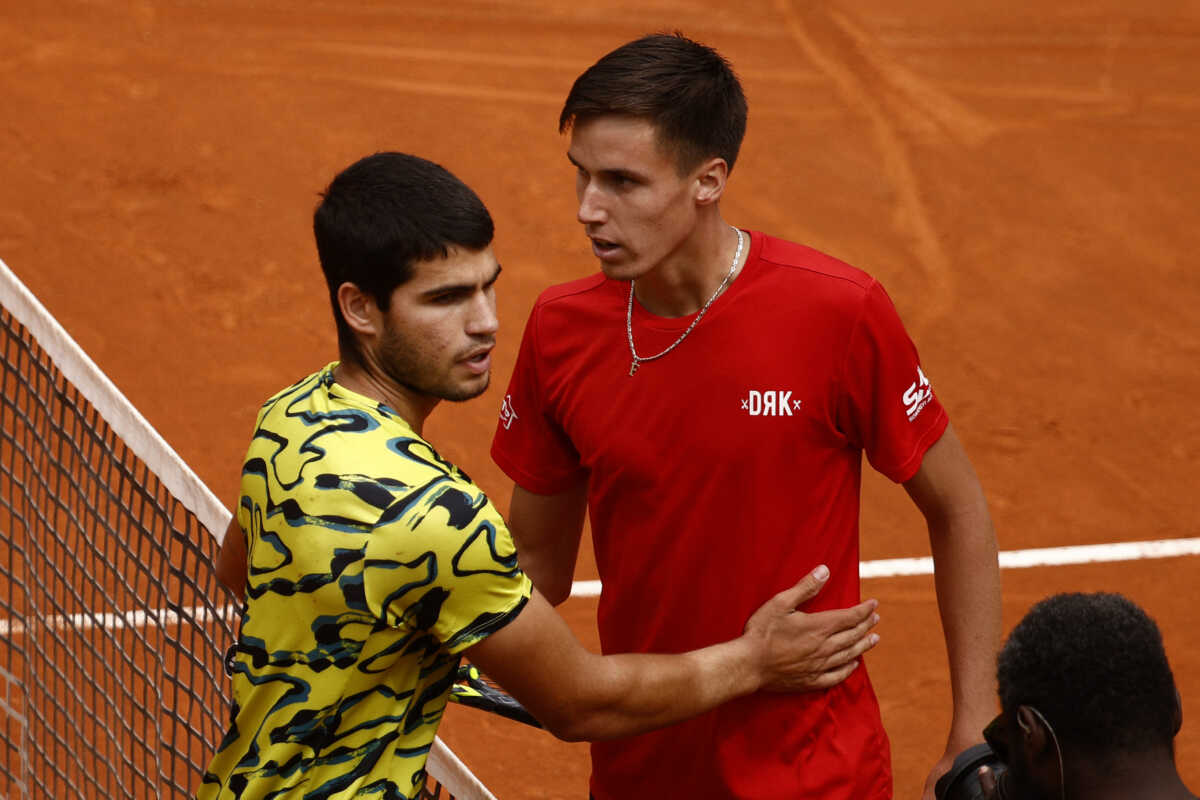 Tennis - Italian Open - Foro Italico, Rome, Italy - May 15, 2023 Hungary's Fabian Marozsan shakes hands with Spain's Carlos Alcaraz after winning his round of 32 match REUTERS