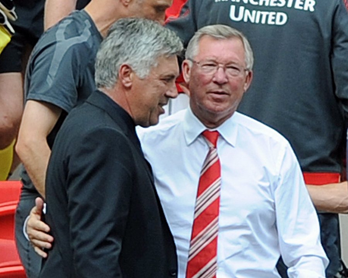 epa02278154 Manchester United manager Sir Alex Ferguson (R) is congratulated by  Chelsea manager Carlo Ancelotti (L) after the Community Shield soccer match at Wembley Stadium, London, England, Britain, 08 August 2010. Manchester United won the match 3-1.  EPA