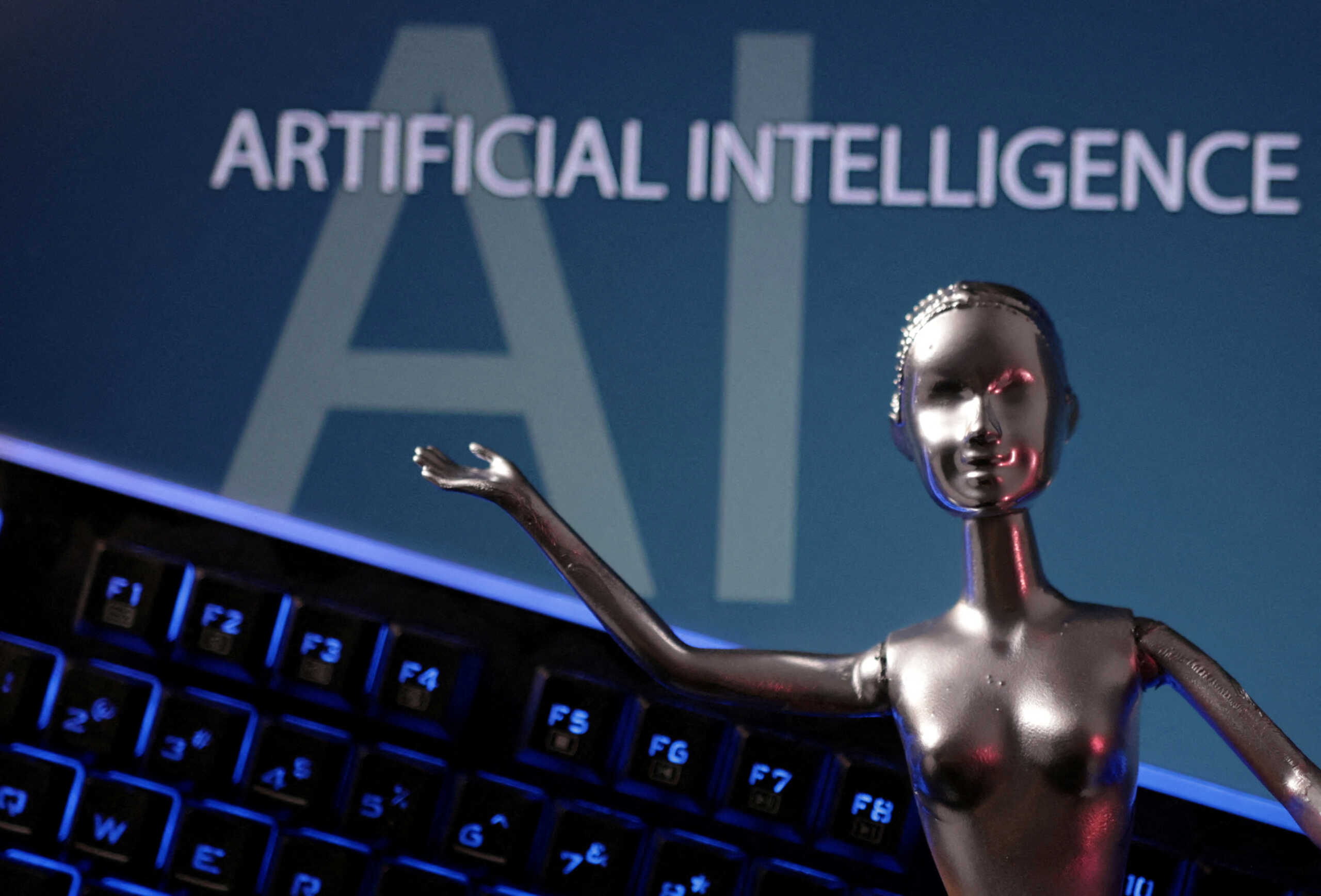 FILE PHOTO: AI Artificial Intelligence words are seen in this illustration taken, May 4, 2023. REUTERS