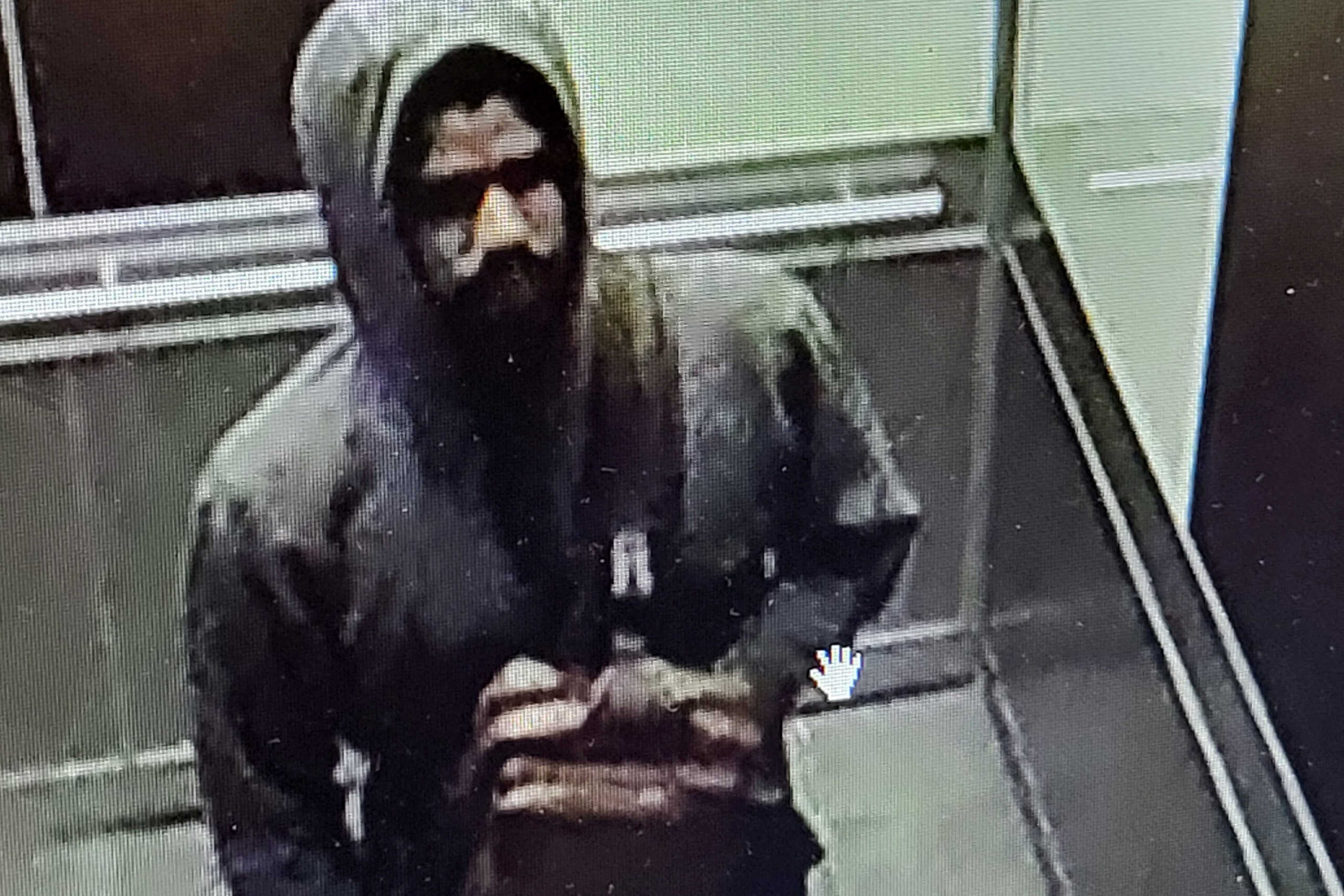 A man who Atlanta Police describe as a shooting suspect stands inside a hospital, in a still image from surveillance video in Atlanta, Georgia, U.S. May 3, 2023.  Atlanta Police Department