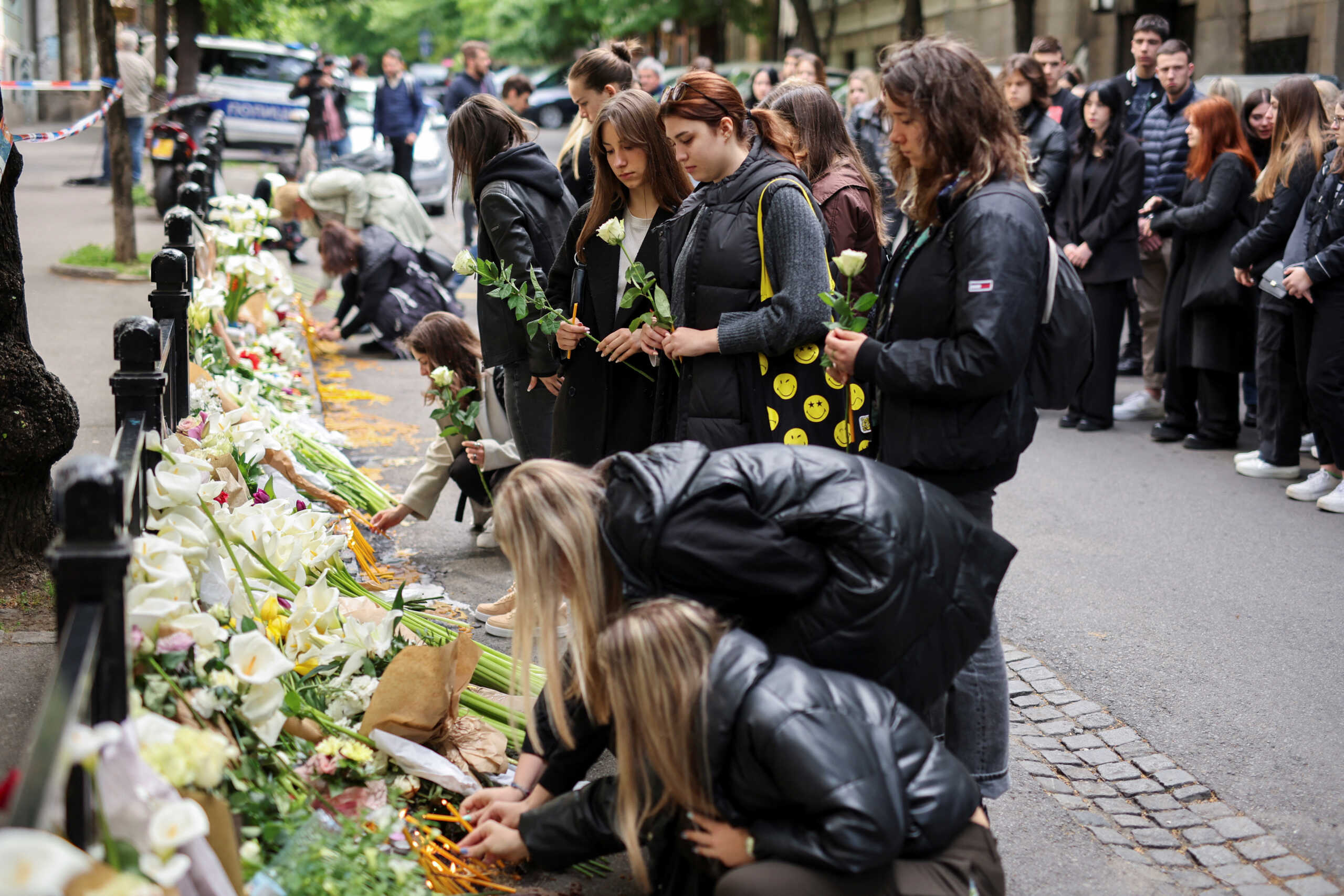 People pay tribute following a school mass shooting, after a boy opened fire on others, killing fellow students and staff in Belgrade, Serbia, May 4, 2023. REUTERS