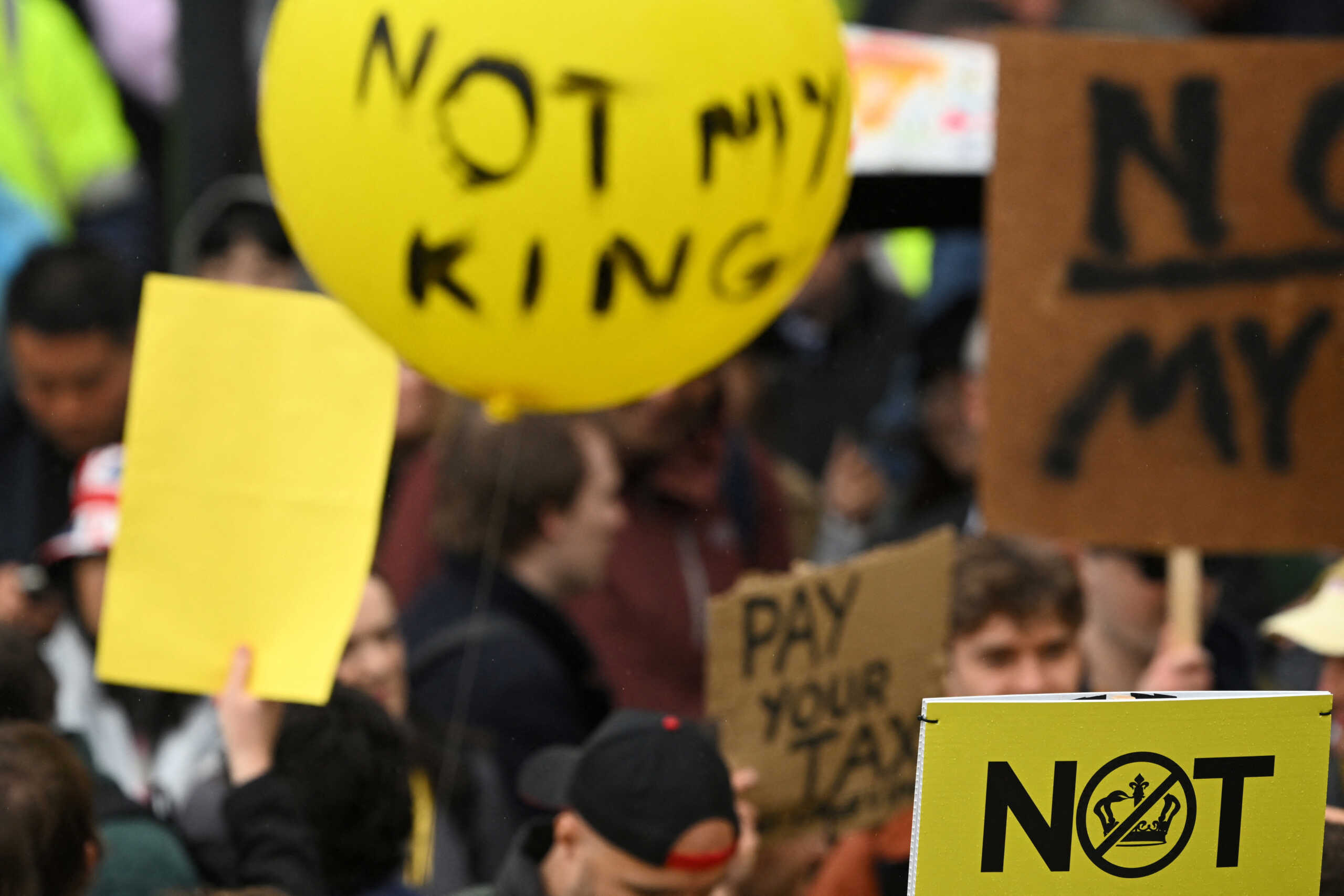 Members of the anti-monarchist group Republic stage a protest close to where Britain's King Charles III and Britain's Camilla, Queen Consort will be crowned at Westminster Abbey in central London on May 6, 2023. SEBASTIEN BOZON