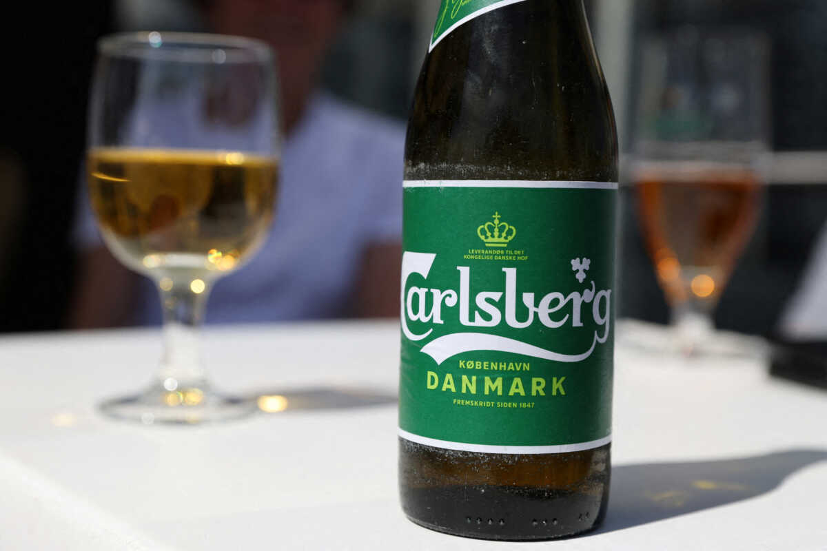 FILE PHOTO: A Carlsberg beer sits on a table in a restaurant in Copenhagen, Denmark, July 30, 2022. REUTERS