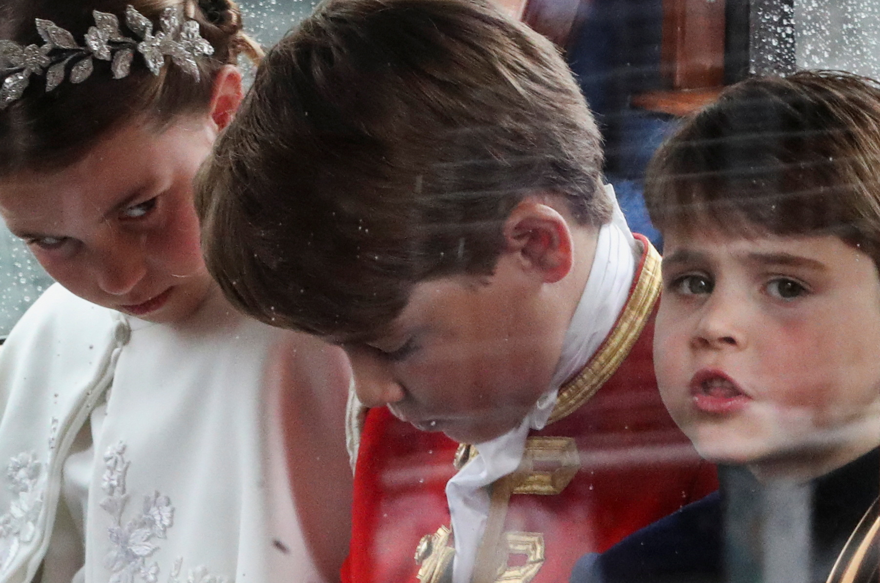 Prince George, Princess Charlotte and Prince Louis sit in a coach following Britain's King Charles and Queen Camilla's coronation in London, Britain May 6, 2023. REUTERS