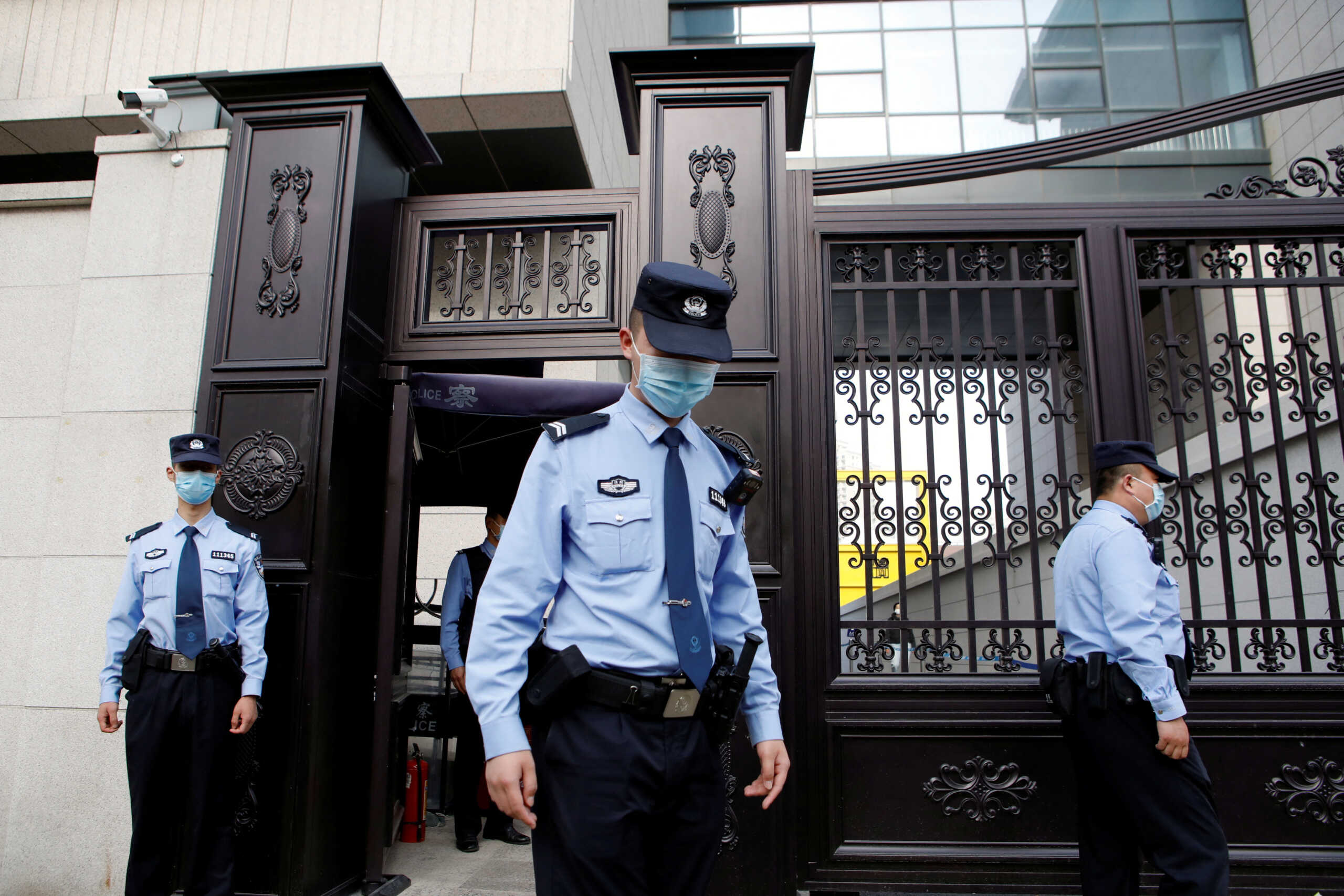 Police officers keep watch outside the No. 3 Intermediate People's Court, where a court hearing of Teresa Xu's suit against a Beijing hospital for rejecting her request to freeze her eggs on the grounds that she is unmarried took place, in Beijing, China May 9, 2023. REUTERS