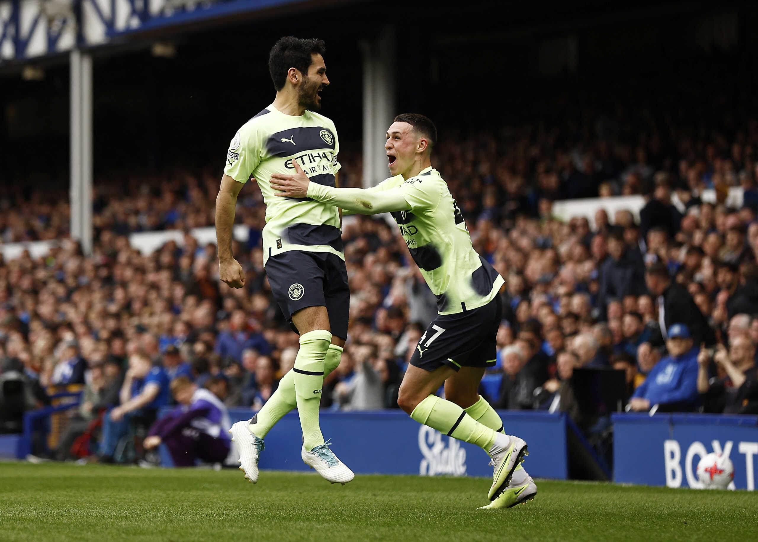 Soccer Football - Premier League - Everton v Manchester City - Goodison Park, Liverpool, Britain - May 14, 2023 Manchester City's Ilkay Gundogan celebrates scoring their third goal with teammate Phil Foden Action Images via Reuters