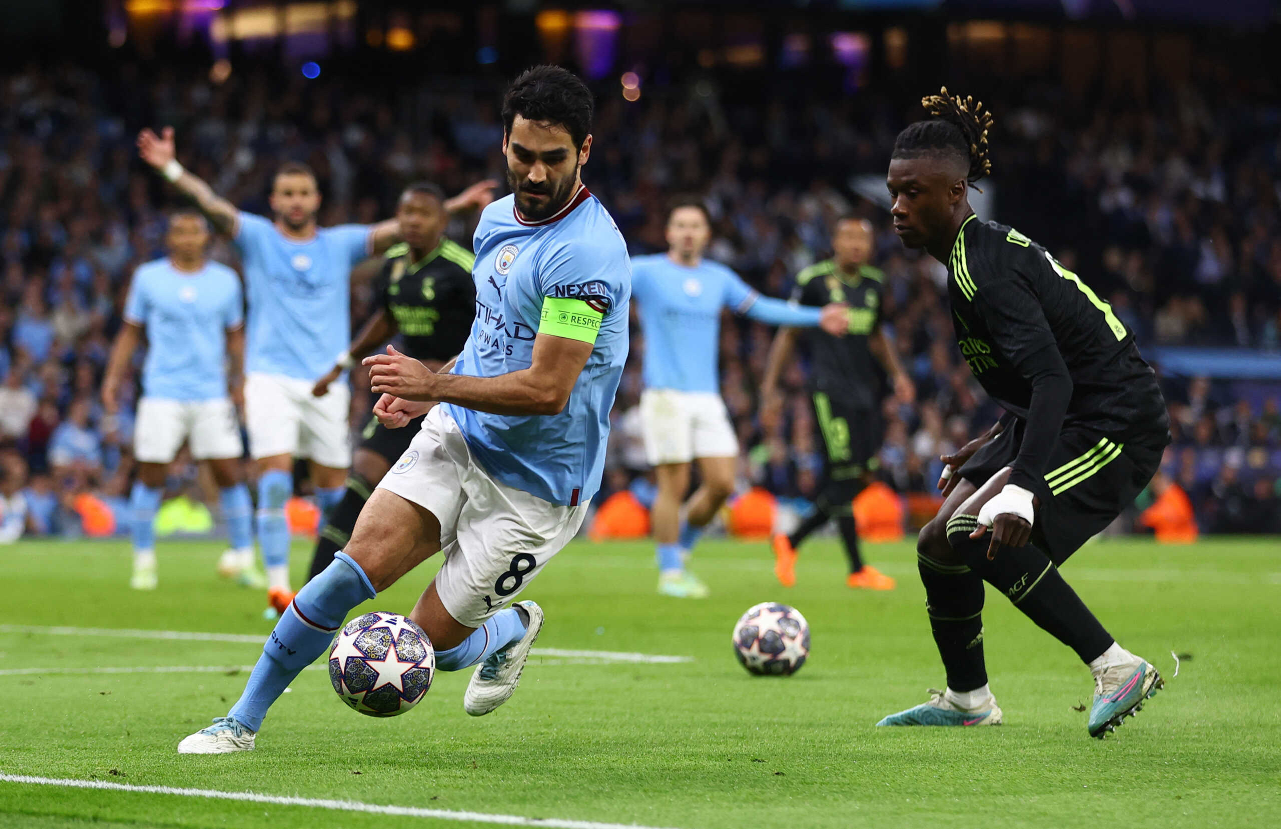 Soccer Football - Champions League - Semi Final - Second Leg - Manchester City v Real Madrid - Etihad Stadium, Manchester, Britain - May 17, 2023 Manchester City's Ilkay Gundogan in action with Real Madrid's Eduardo Camavinga as play is stopped due to two balls being on the pitch REUTERS