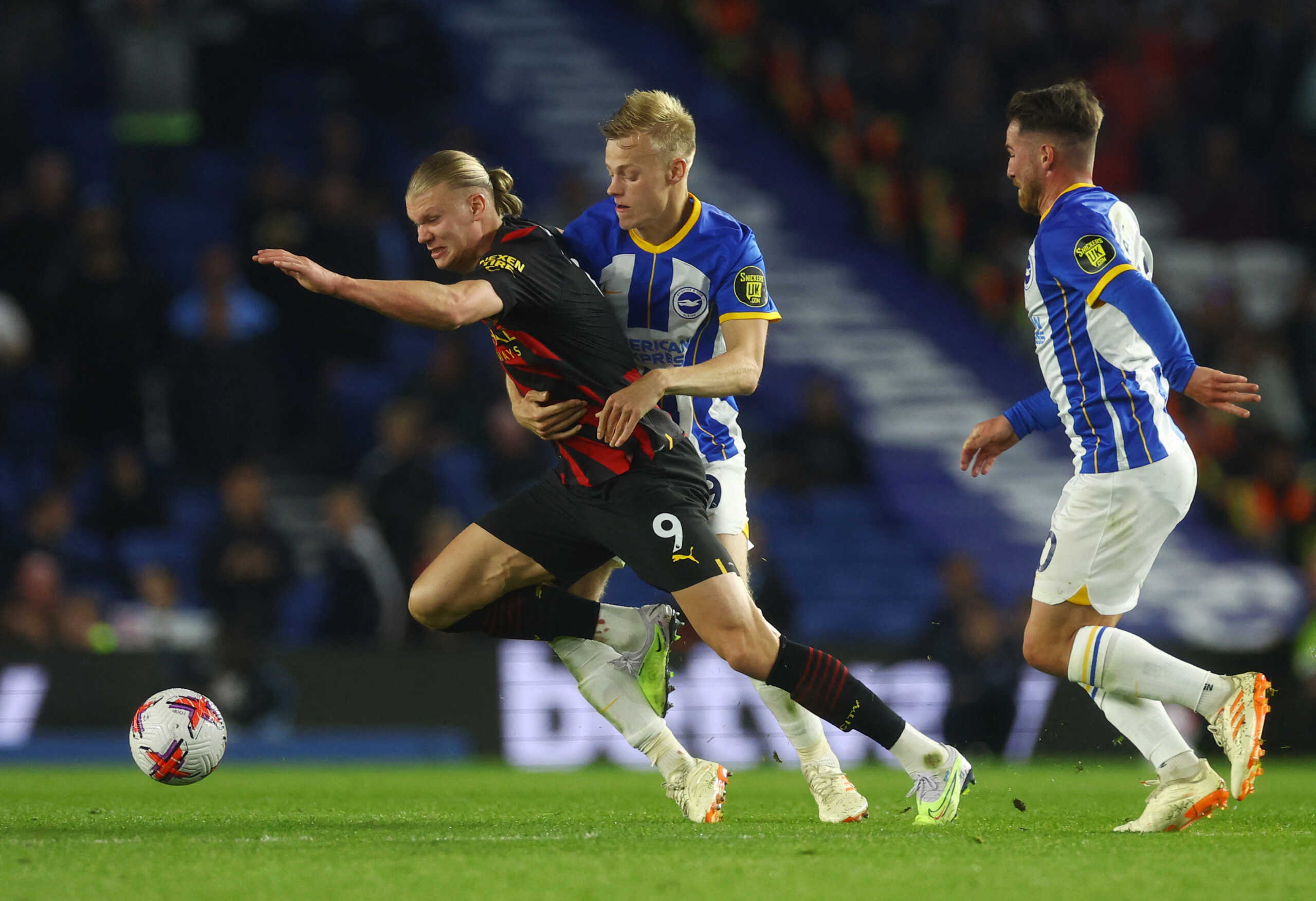Soccer Football - Premier League - Brighton & Hove Albion v Manchester City - The American Express Community Stadium, Brighton, Britain - May 24, 2023 Manchester City's Erling Braut Haaland in action with Brighton & Hove Albion's Jan Paul van Hecke Action Images via Reuters