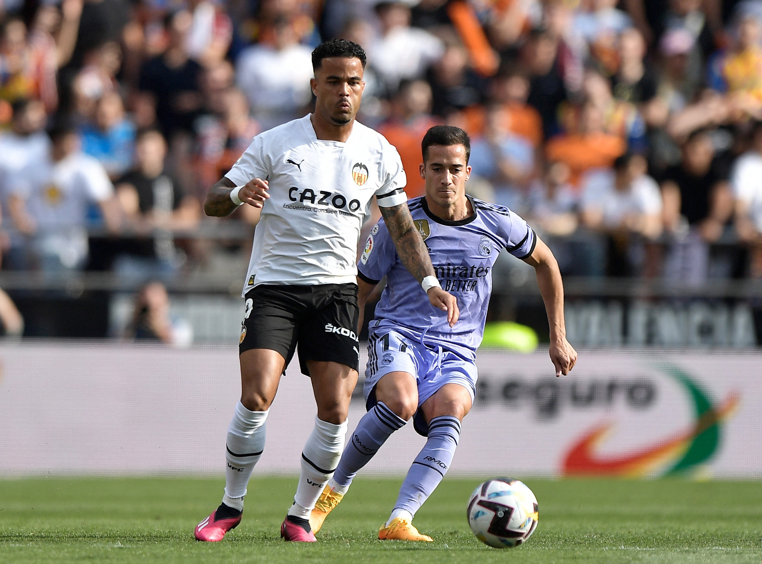 Soccer Football - LaLiga - Valencia v Real Madrid - Mestalla, Valencia, Spain - May 21, 2023 Valencia's Justin Kluivert in action with Real Madrid's Lucas Vazquez REUTERS