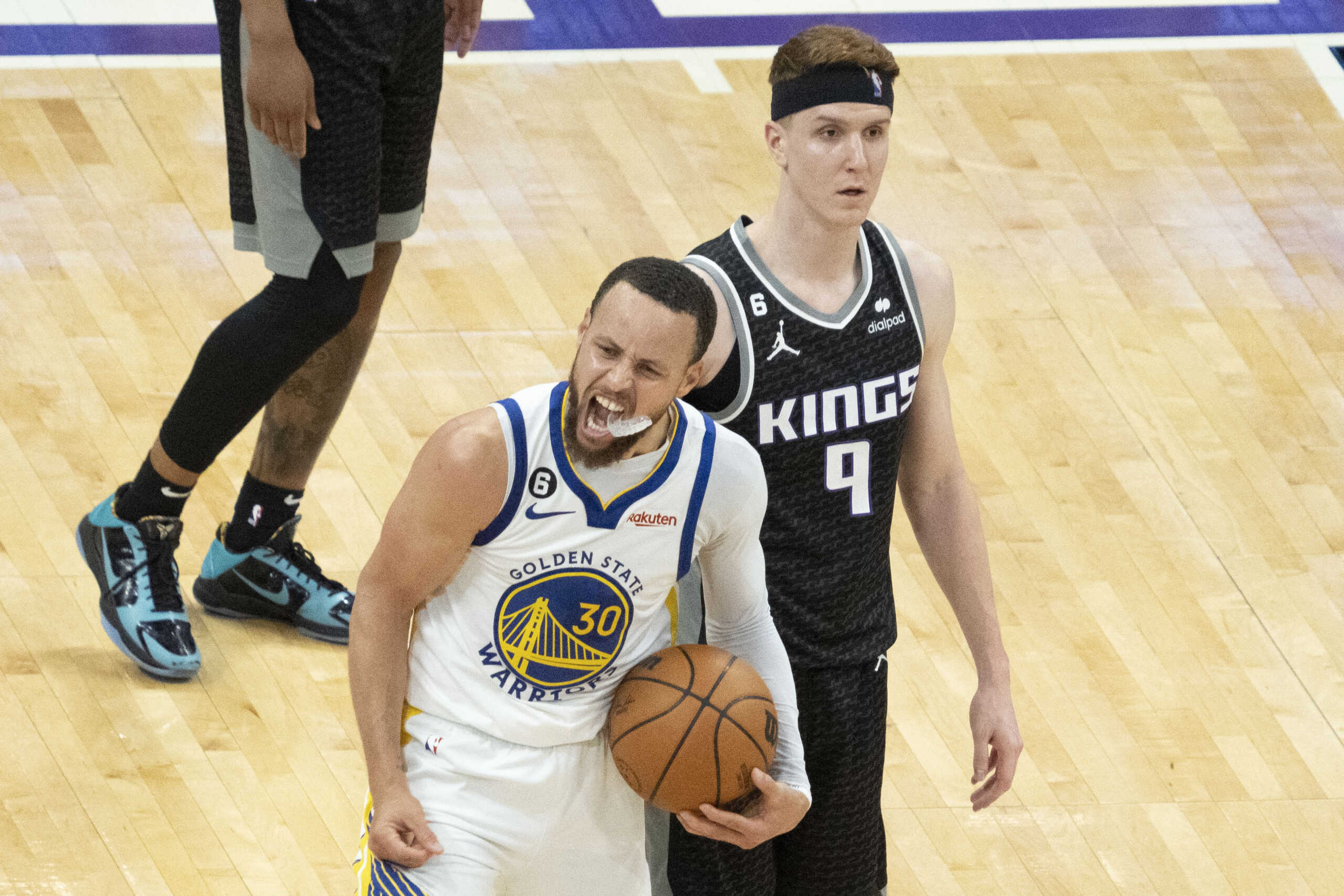 April 30, 2023; Sacramento, California, USA; Golden State Warriors guard Stephen Curry (30) celebrates in front of Sacramento Kings guard Kevin Huerter (9) during the fourth quarter in game seven of the 2023 NBA playoffs first round at Golden 1 Center. Mandatory Credit: Kyle Terada-USA TODAY Sports
