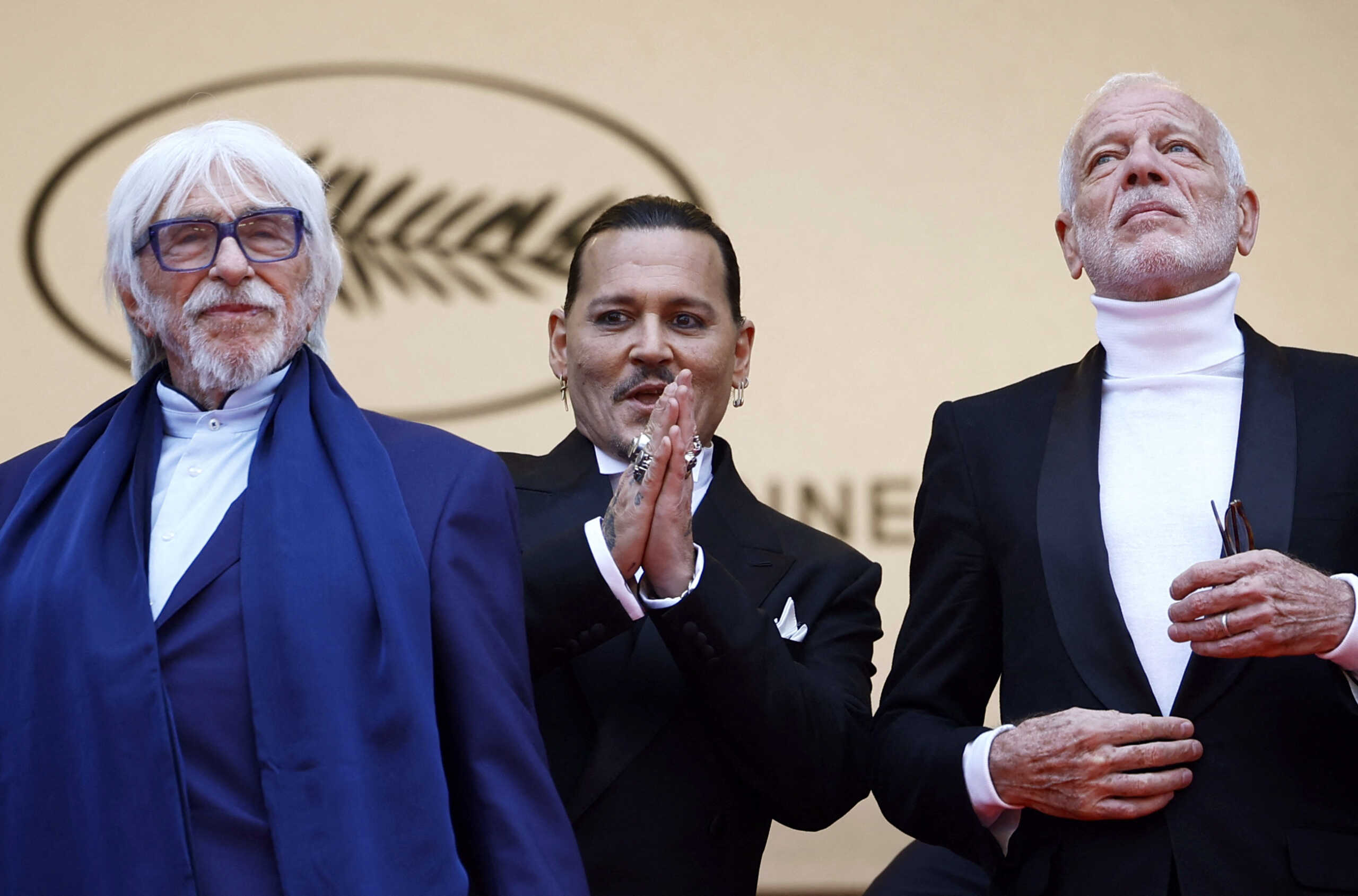 The 76th Cannes Film Festival - Opening ceremony and screening of the film "Jeanne du Barry" Out of competition - Red Carpet arrivals - Cannes, France, May 16, 2023.  Johnny Depp, Pierre Richard and Pascal Greggory pose. REUTERS