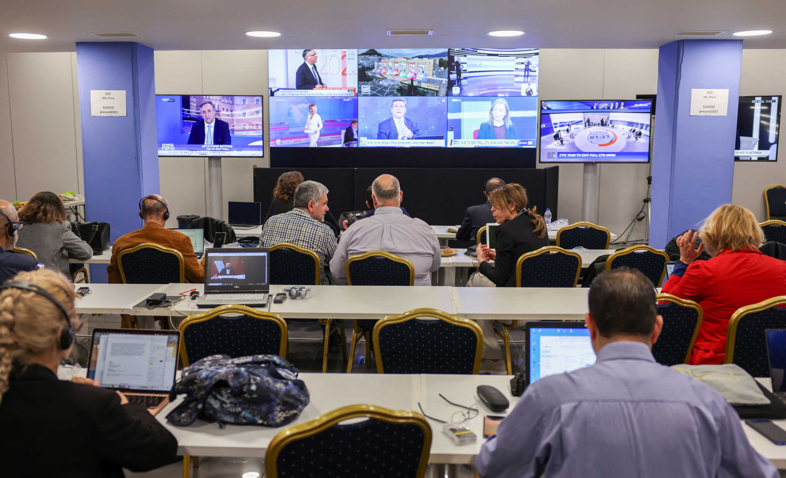 People sit at the New Democracy conservative party's headquarters after the general election, in Athens, Greece, May 21, 2023.  REUTERS