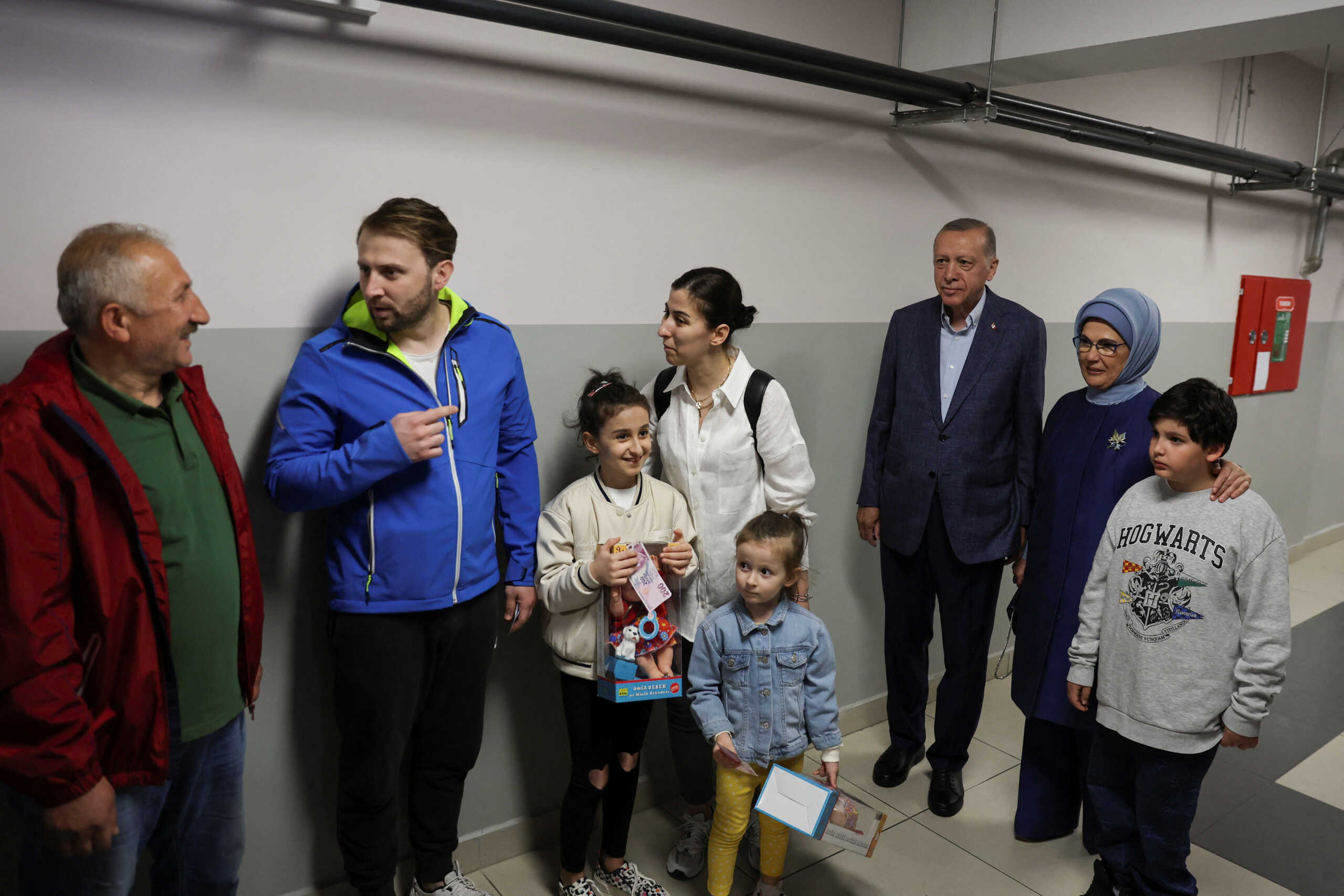 Turkish President Tayyip Erdogan and his wife Emine Erdogan wait to vote at a polling station in Istanbul, Turkey May 14, 2023. REUTERS
