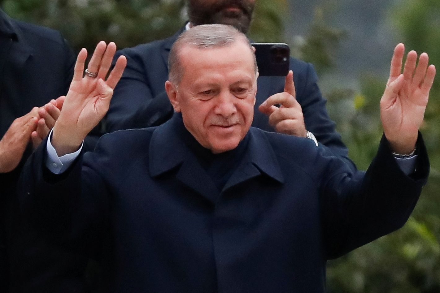Turkish President Tayyip Erdogan gestures as he addresses his supporters following early exit poll results for the second round of the presidential election in Istanbul, Turkey May 28, 2023. REUTERS