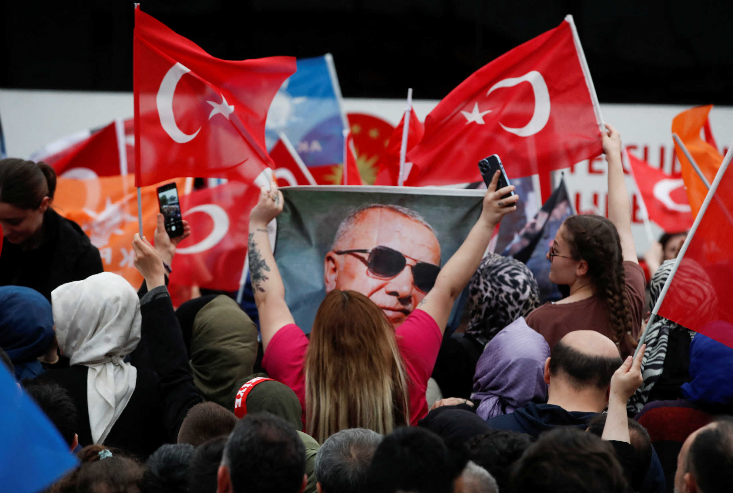 Supporters of Turkish President Tayyip Erdogan wait for his address following early exit poll results for the second round of the presidential election in Istanbul, Turkey May 28, 2023. REUTERS