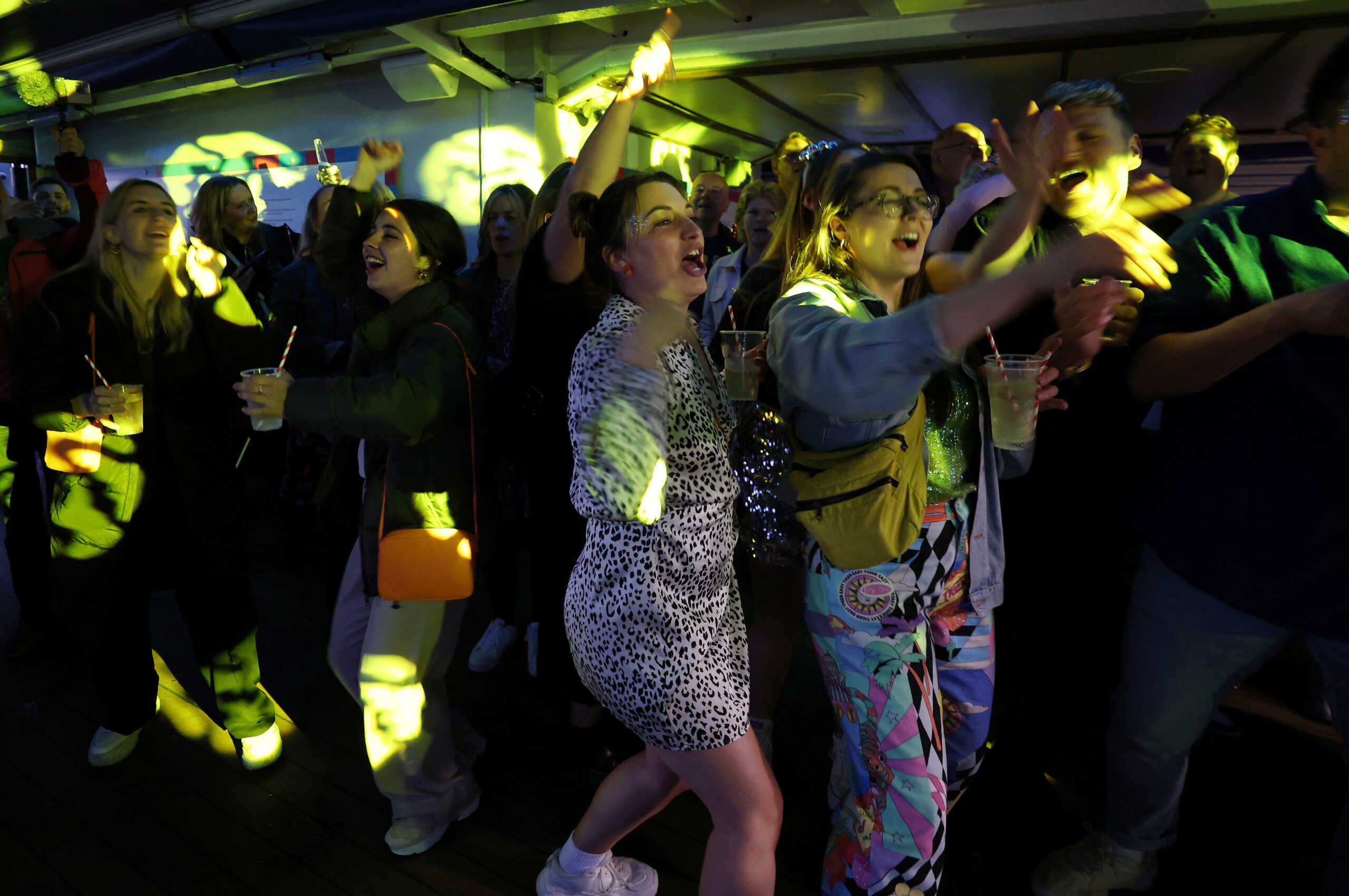 Eurovision fans dance on one of the Mersey Ferries during a Eurovision party cruise as part of the Eurovision celebrations in Liverpool, Britain May 8, 2023. REUTERS