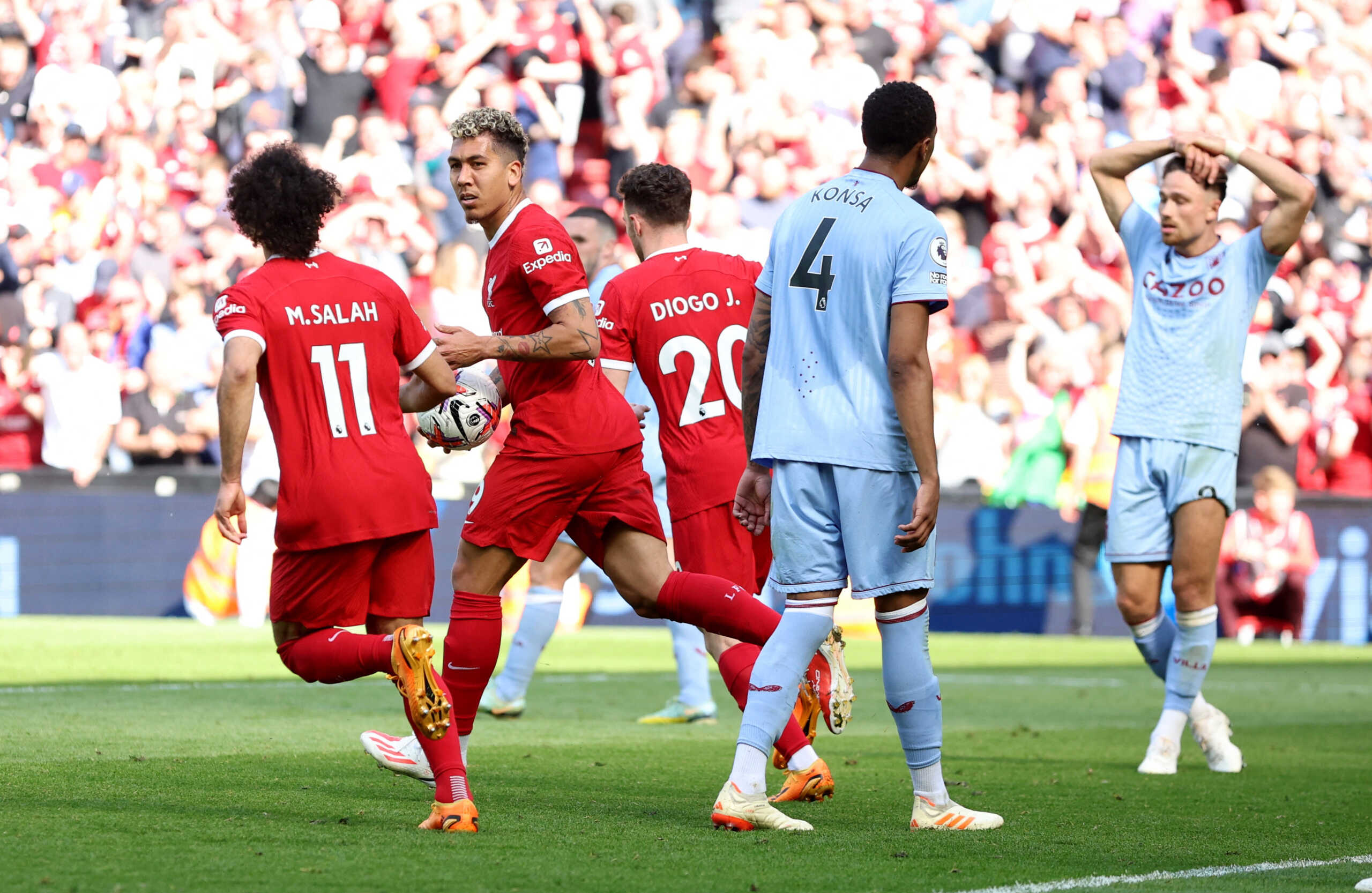 Soccer Football - Premier League - Liverpool v Aston Villa - Anfield, Liverpool, Britain - May 20, 2023 Liverpool's Roberto Firmino celebrates scoring their first goal with Mohamed Salah and Diogo Jota REUTERS