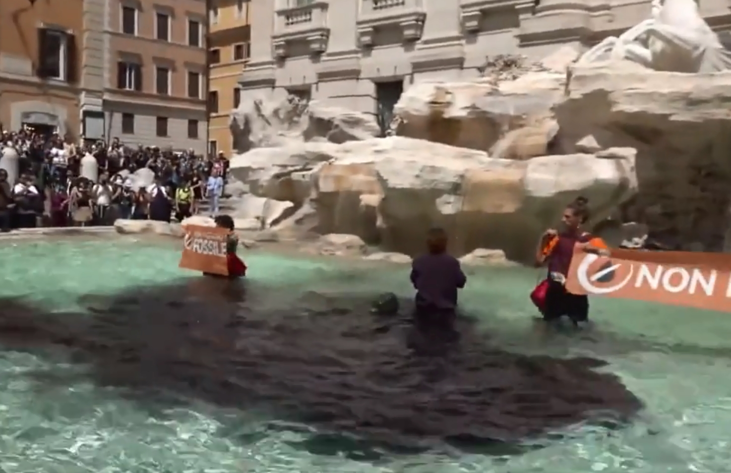 Activists ‘paint’ the Trevi Fountain black