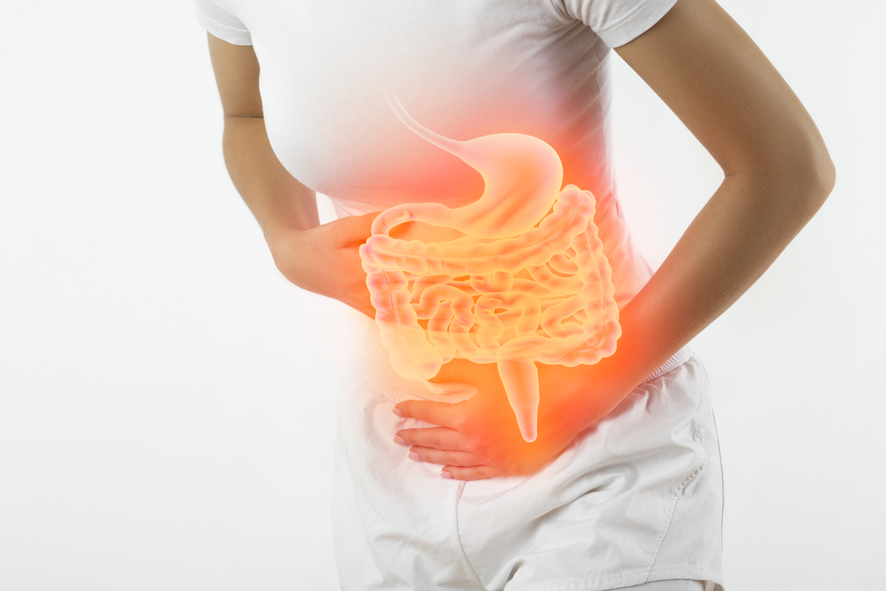 Woman touching stomach
