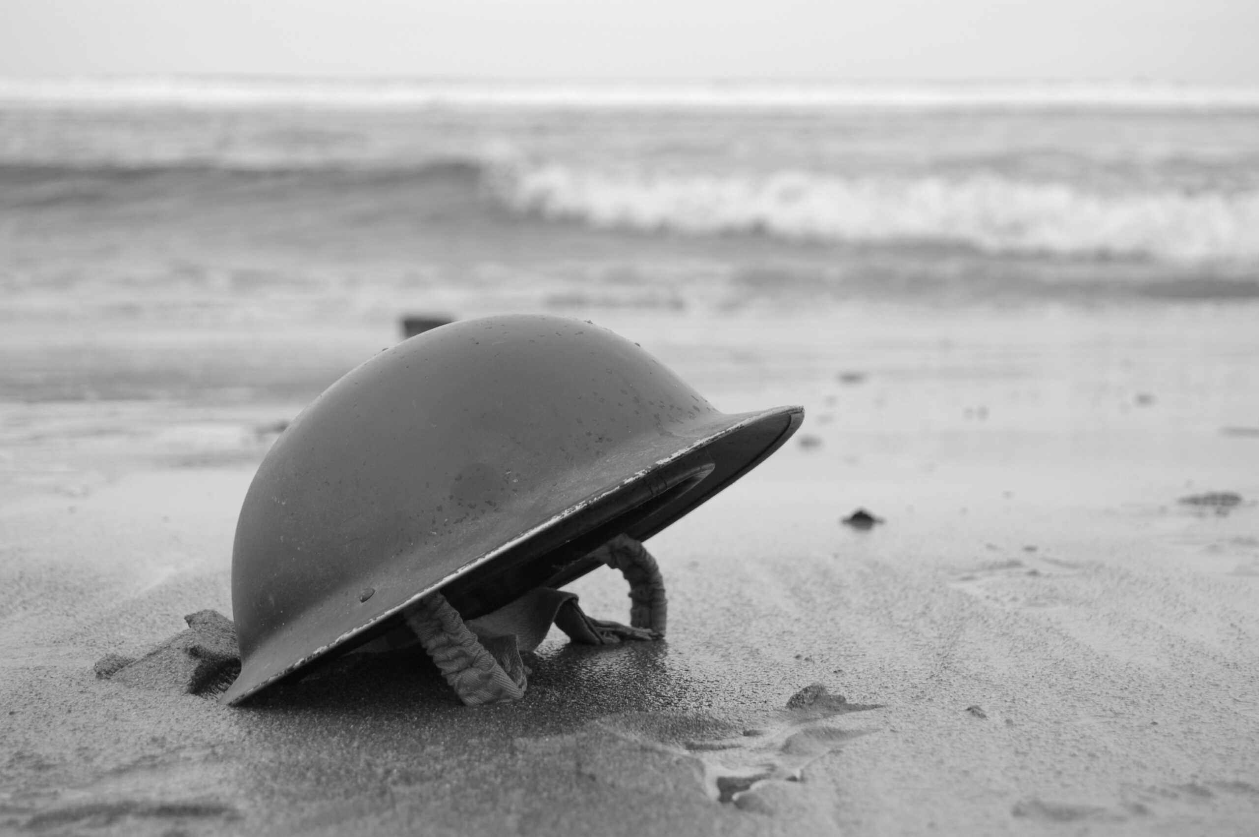 British Army Helmet left on the beach at Dunkirk after the retreat from the Germans 1940.re-enactment.