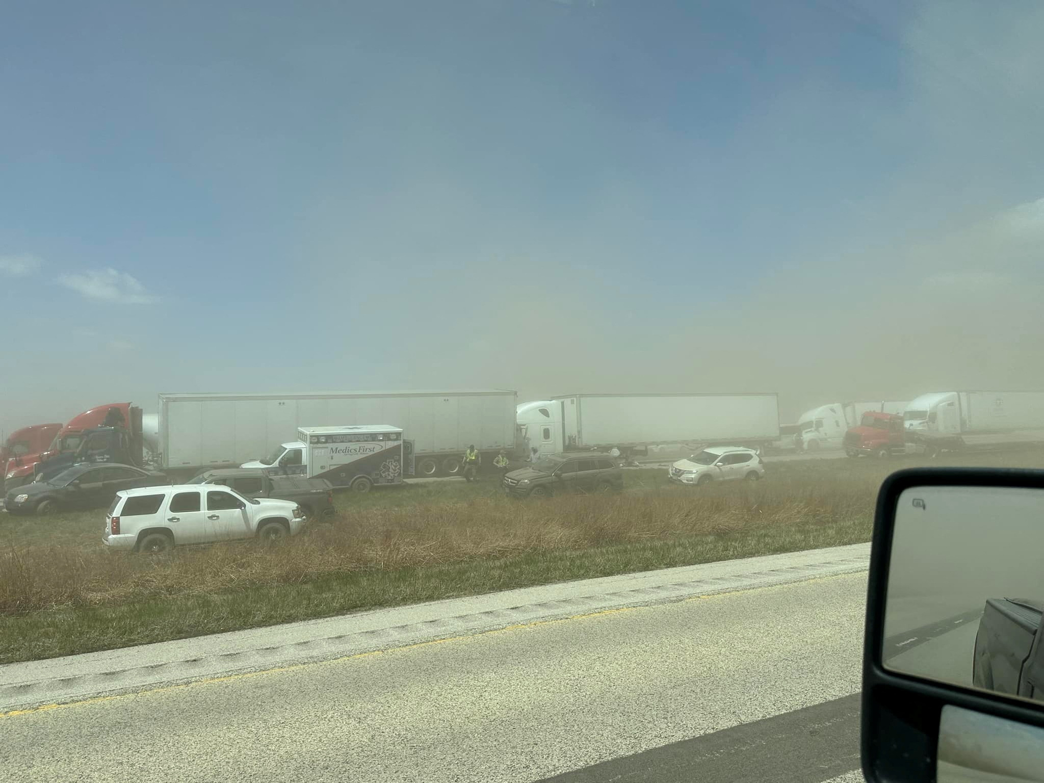 A view of vehicles in a dust storm, which cut visibility to near zero and triggered a series of chain-reaction crashes involving dozens of vehicles, on a highway in Springfield, Illinois, U.S. May 1, 2023 in this picture obtained from social media.  Thomas DeVore via TMX