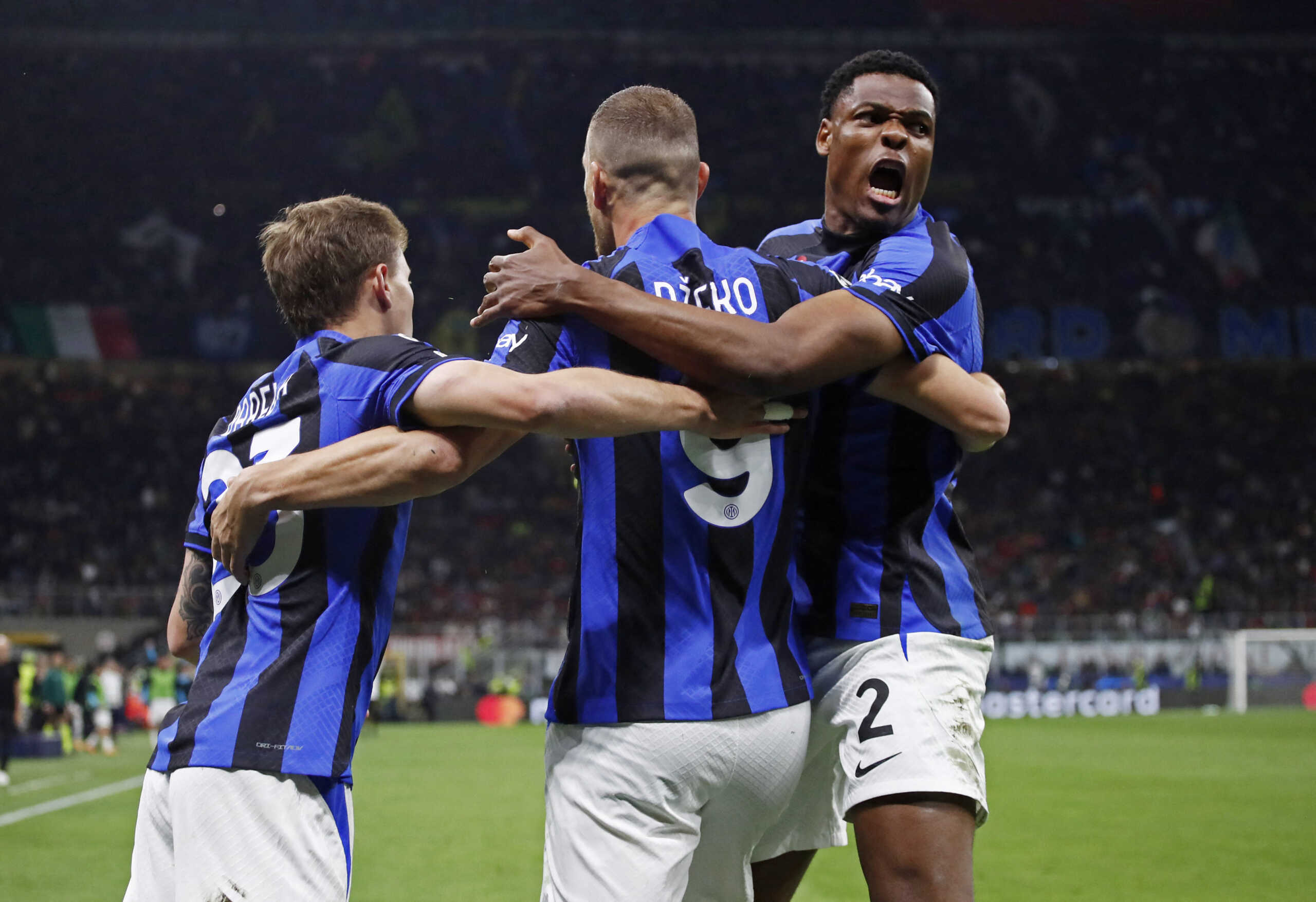 Soccer Football - Champions League - Semi Final - First Leg - AC Milan v Inter Milan - San Siro, Milan, Italy - May 10, 2023 Inter Milan's Edin Dzeko celebrates scoring their first goal with Nicolo Barella and Denzel Dumfries REUTERS