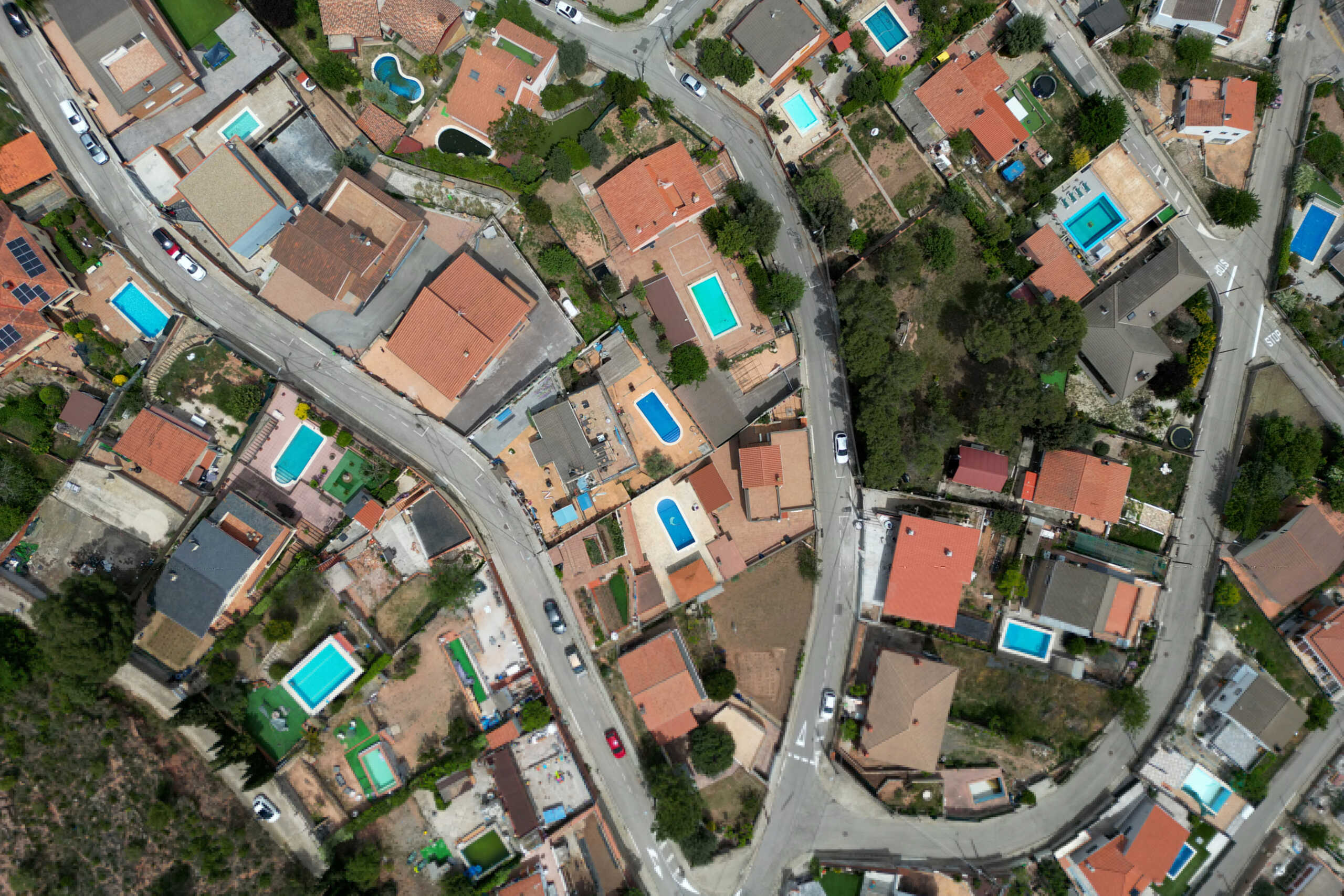 A view shows swimming pools adjacent to houses, as drinking water supplies have plunged to their lowest level since 1990 due to extreme drought, in Vacarisses, Spain May 4, 2023. REUTERS