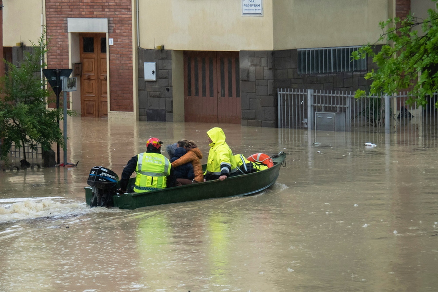 epa10634236 Rescue services members in a boat evacuate a woman on a flooded road as help for people affected by flood continues, giving priority to the elderly and people in difficulty, in Faenza, near Ravenna, Italy, 17 May 2023. The water of the river Lamone is slowly receding, in its place remain mud, debris and waste after a fresh wave of torrential rain battered Italy, especially the northeastern region of Emilia-Romagna and other parts of the Adriatic coast.  EPA