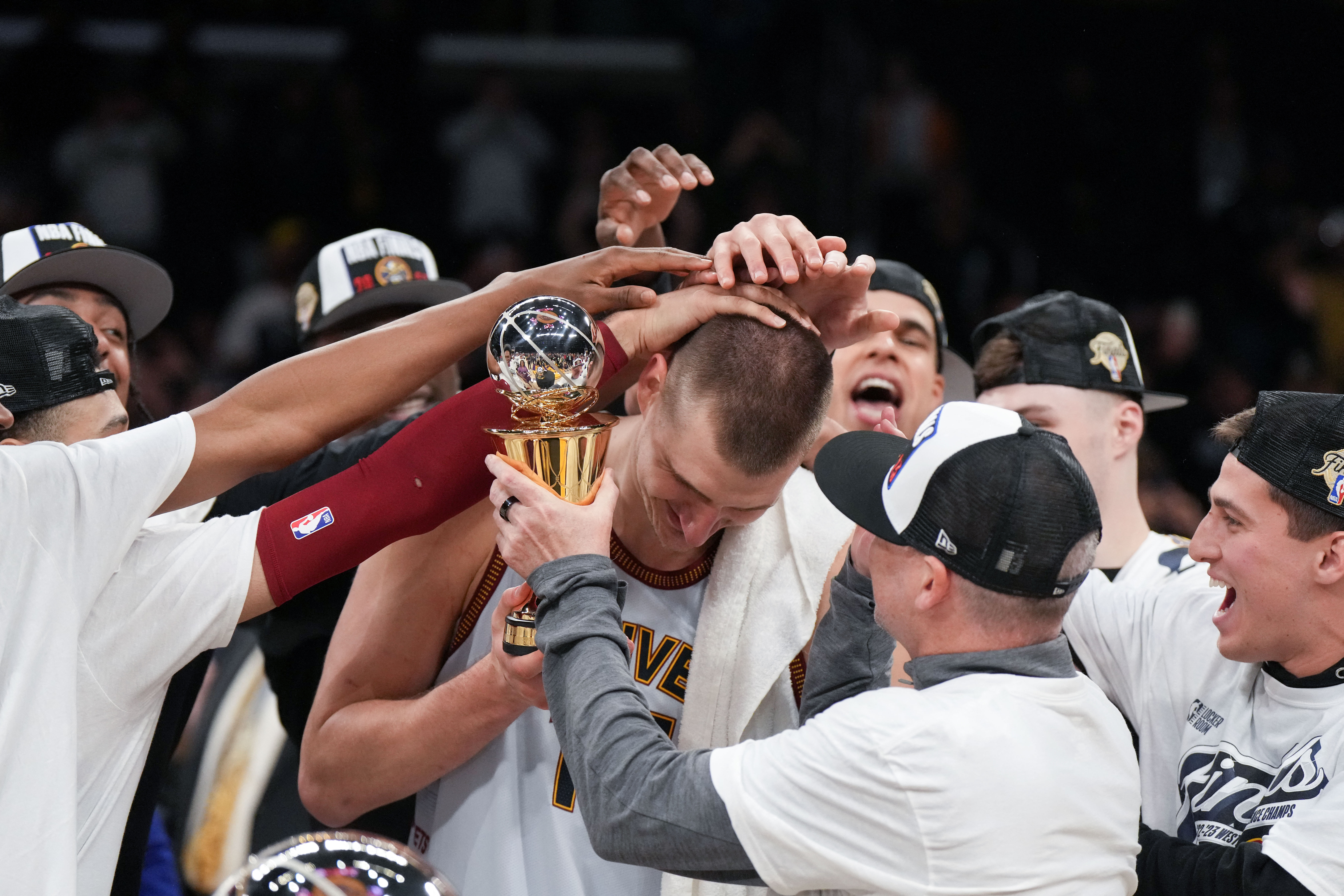 May 22, 2023; Los Angeles, California, USA; Denver Nuggets center Nikola Jokic (15) and head coach Michael Malone celebrate beating the Los Angeles Lakers in game four of the Western Conference Finals for the 2023 NBA playoffs at Crypto.com Arena. Mandatory Credit: Kirby Lee-USA TODAY Sports