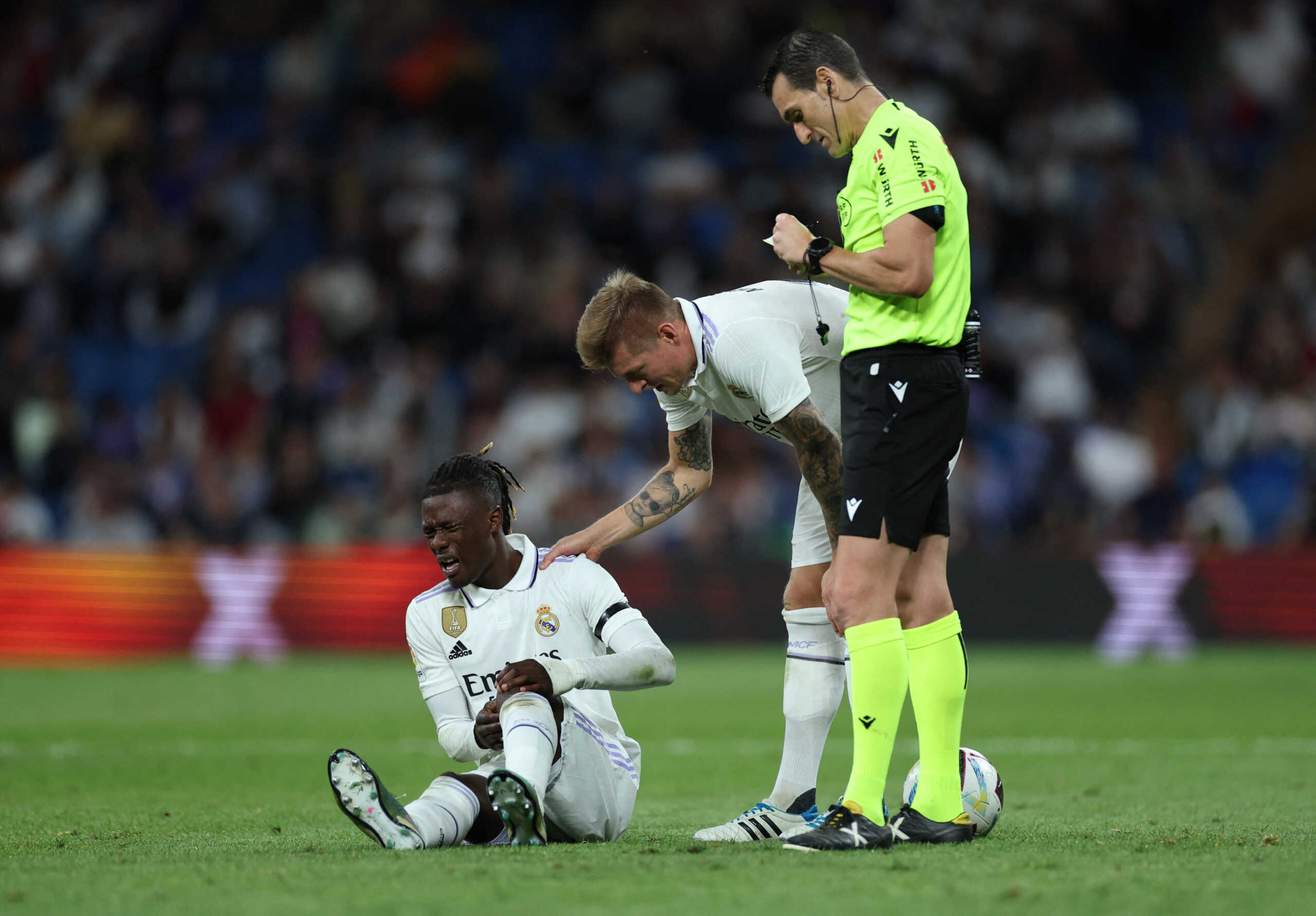 Soccer Football - LaLiga - Real Madrid v Getafe - Santiago Bernabeu, Madrid, Spain - May 13, 2023 Real Madrid's Eduardo Camavinga reacts after sustaining an injury as Toni Kroos looks on REUTERS