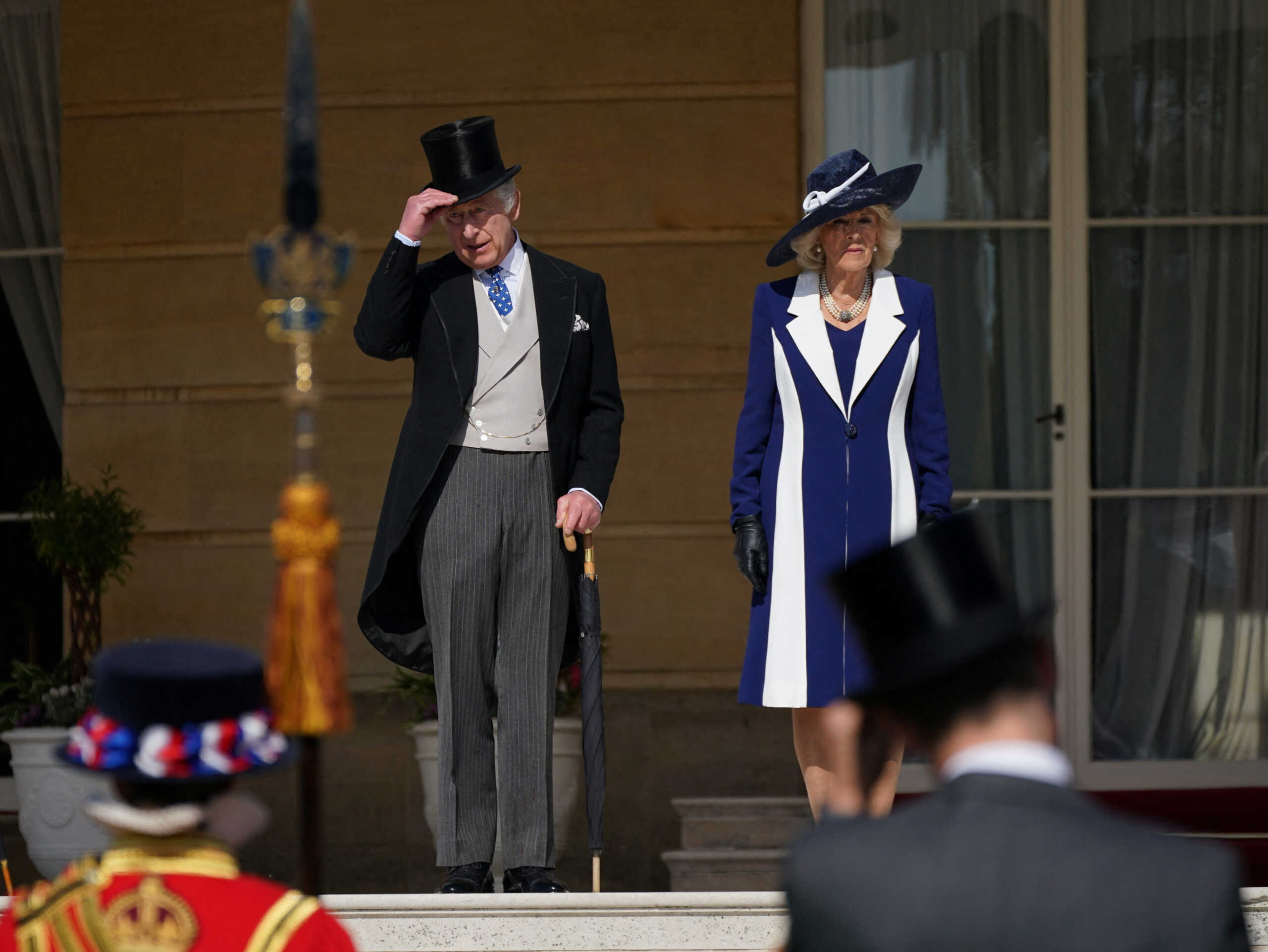 Britain's King Charles and Camilla, Queen Consort stand on the steps during a Garden Party, in celebration of King Charles' coronation, at Buckingham Palace, London, Britain. Picture date: Wednesday May 3, 2023. Yui Mok